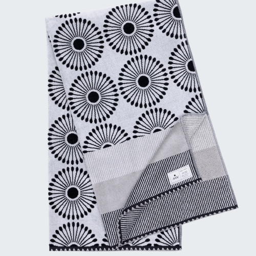 Black and white patterned towel on a white background