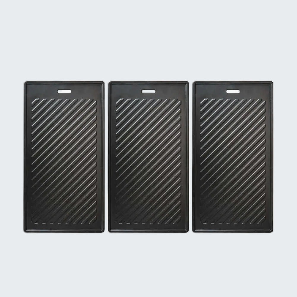 Three black rectangular grills with diagonal patterns on a white background