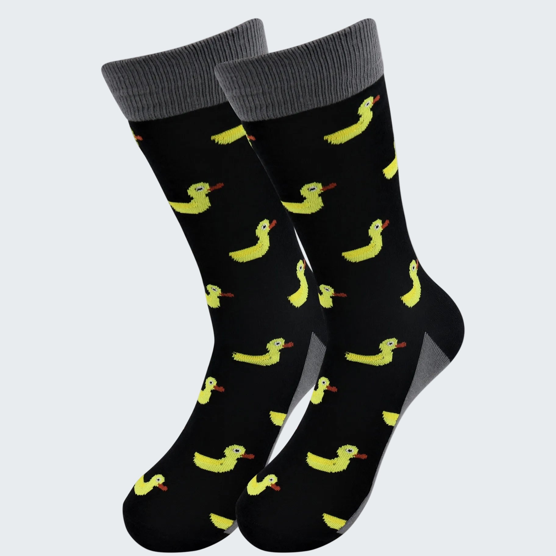 Black socks with yellow duck pattern on a white background