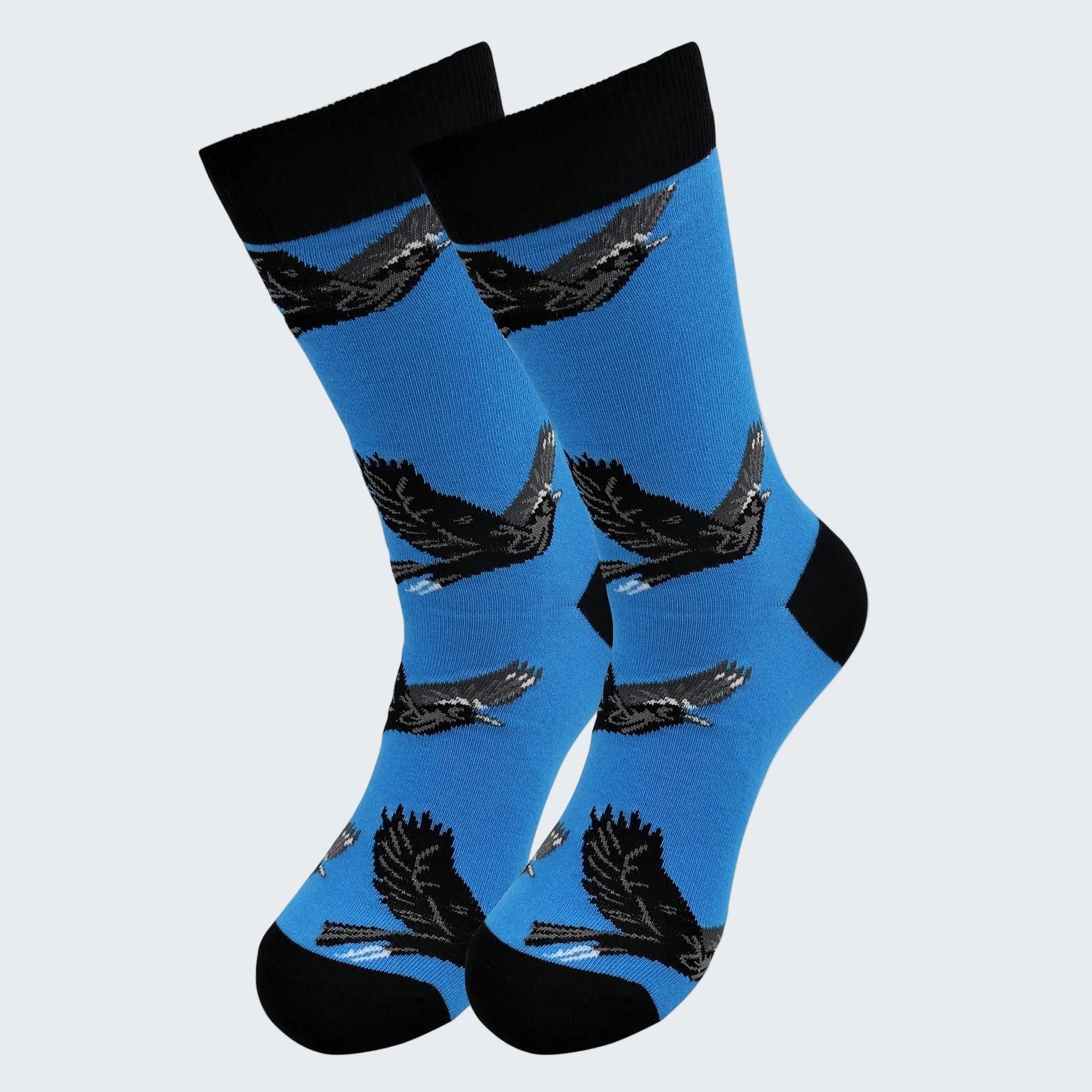 Blue socks with black eagle designs on a white background