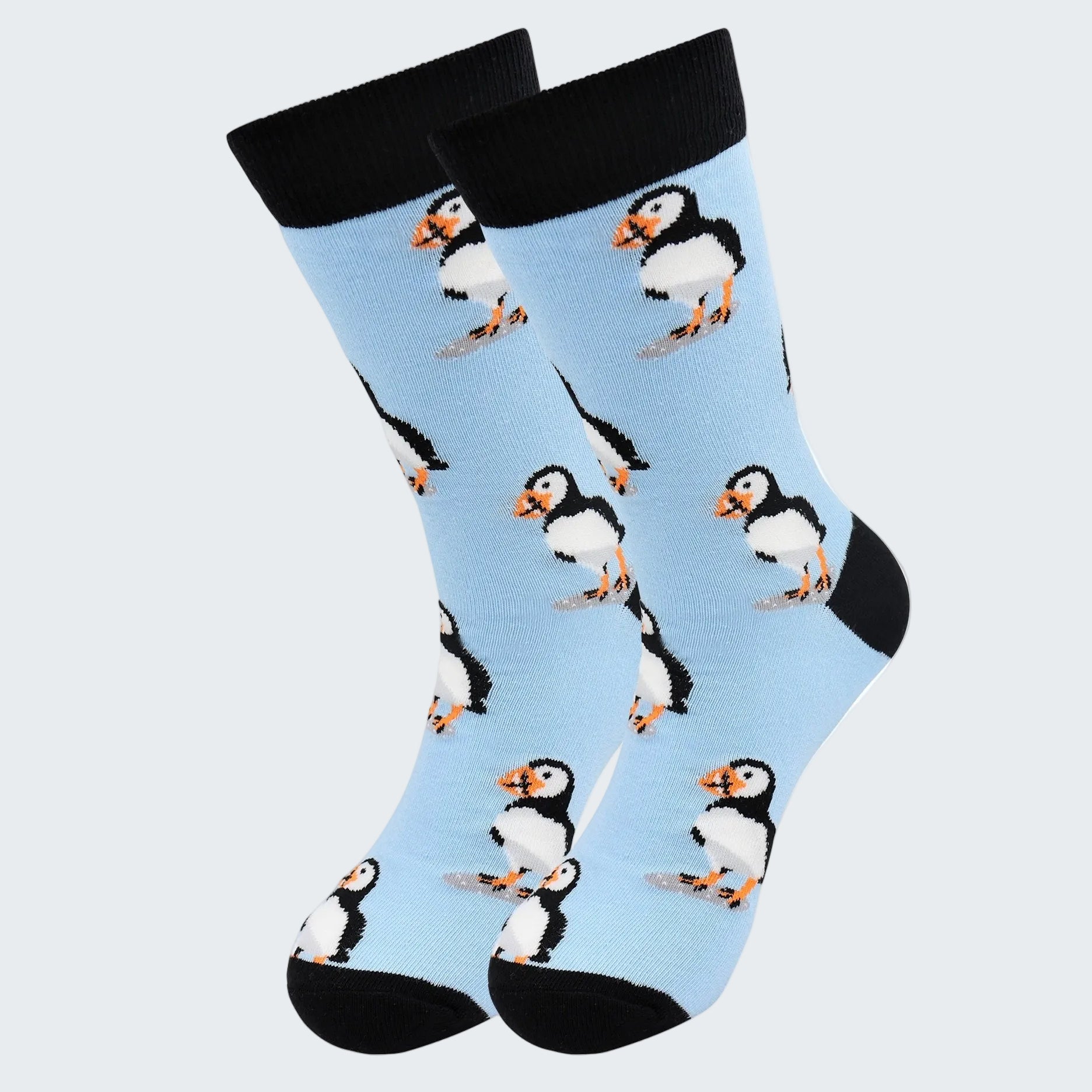 Socks with puffin pattern on a light blue background