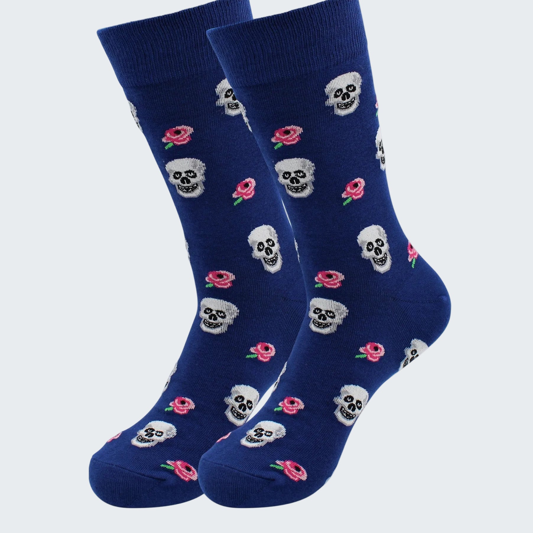 Pair of blue socks with skull and flower pattern on a white background
