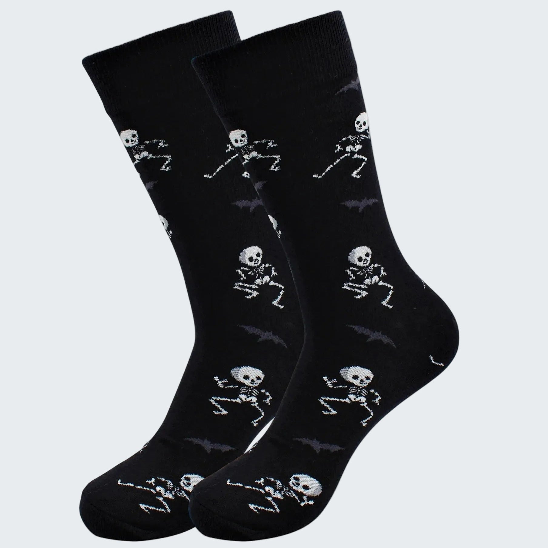 Black socks with skeleton designs on a white background
