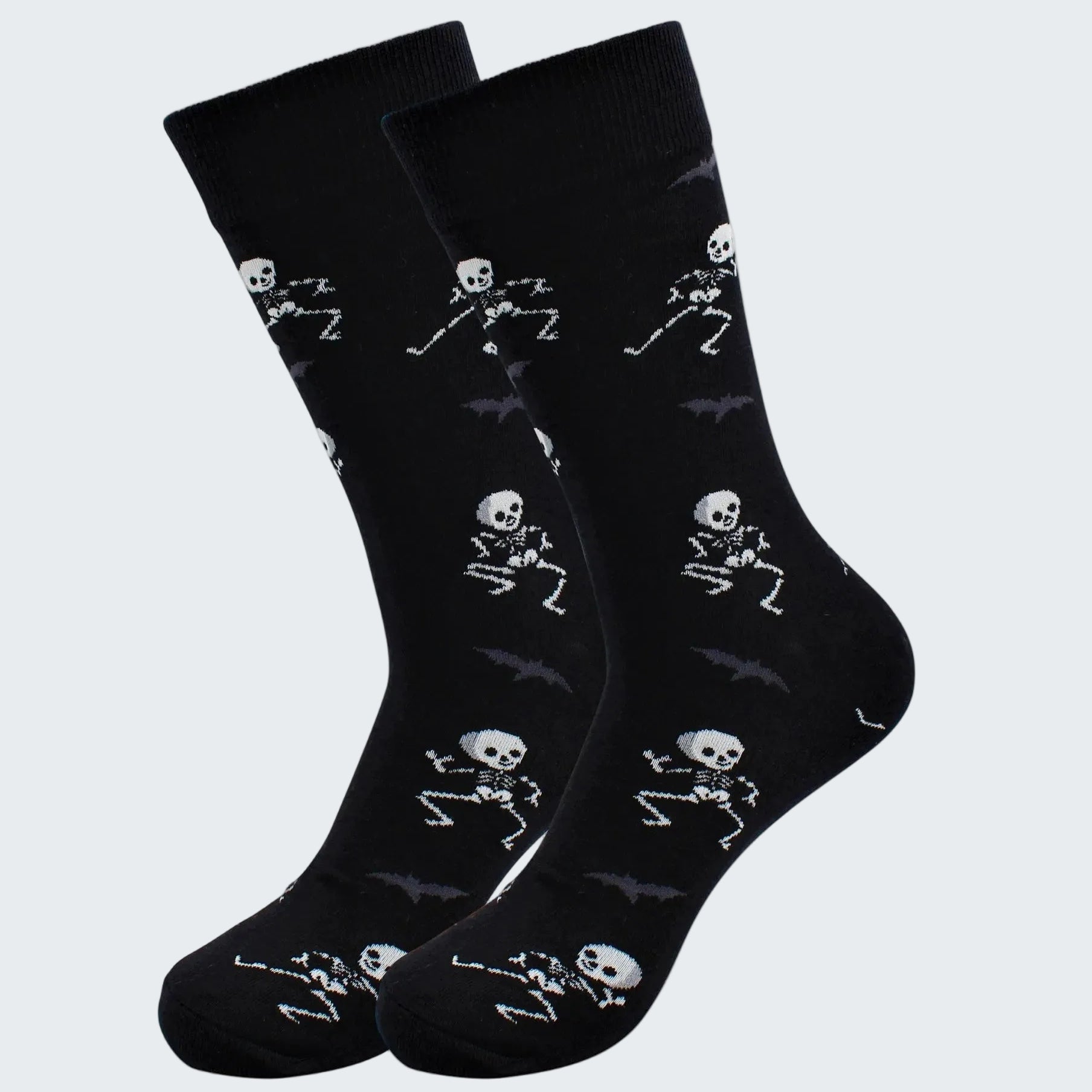 Black socks with skeleton designs on a white background