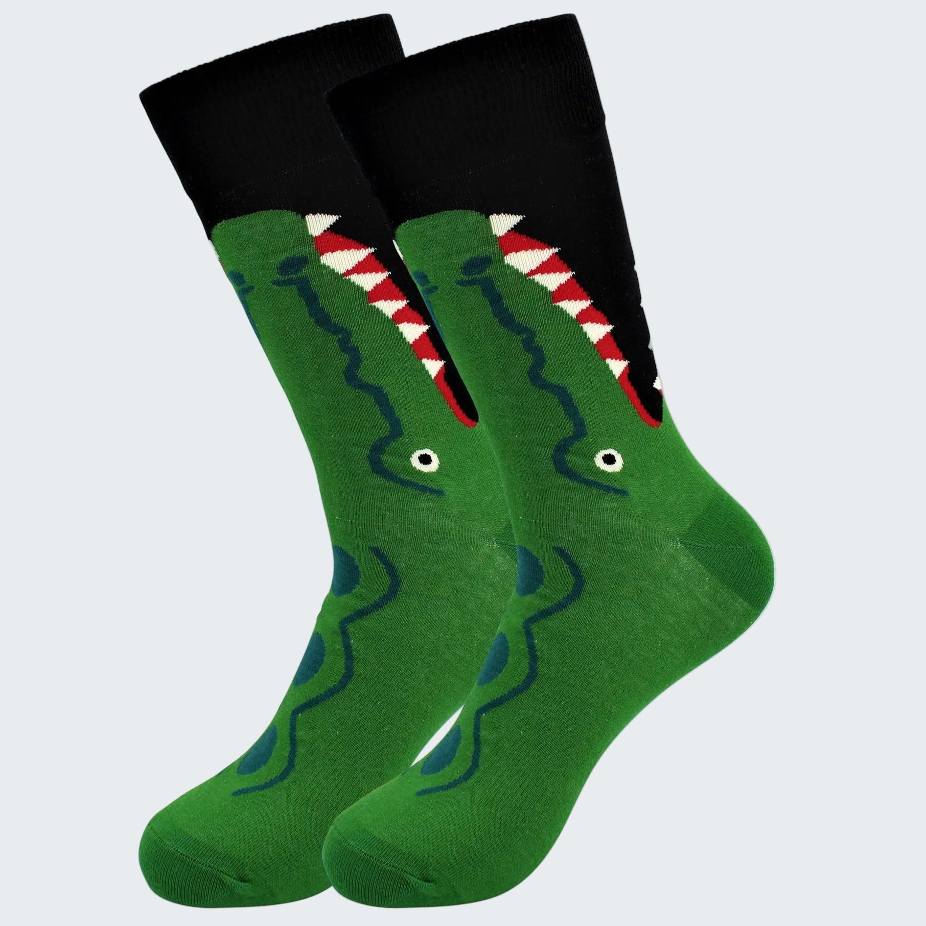 Green socks with a shark design on a white background