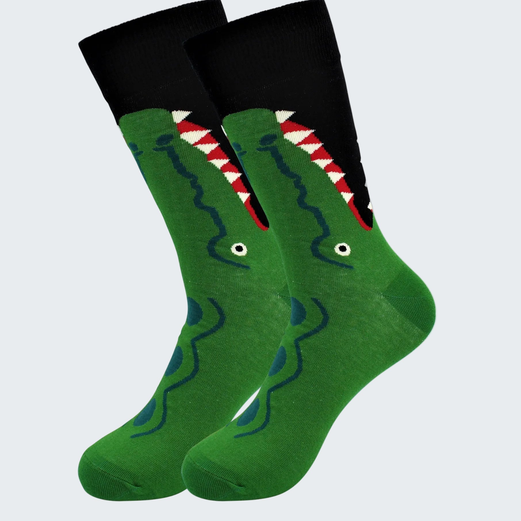 Green socks with a shark design on a white background
