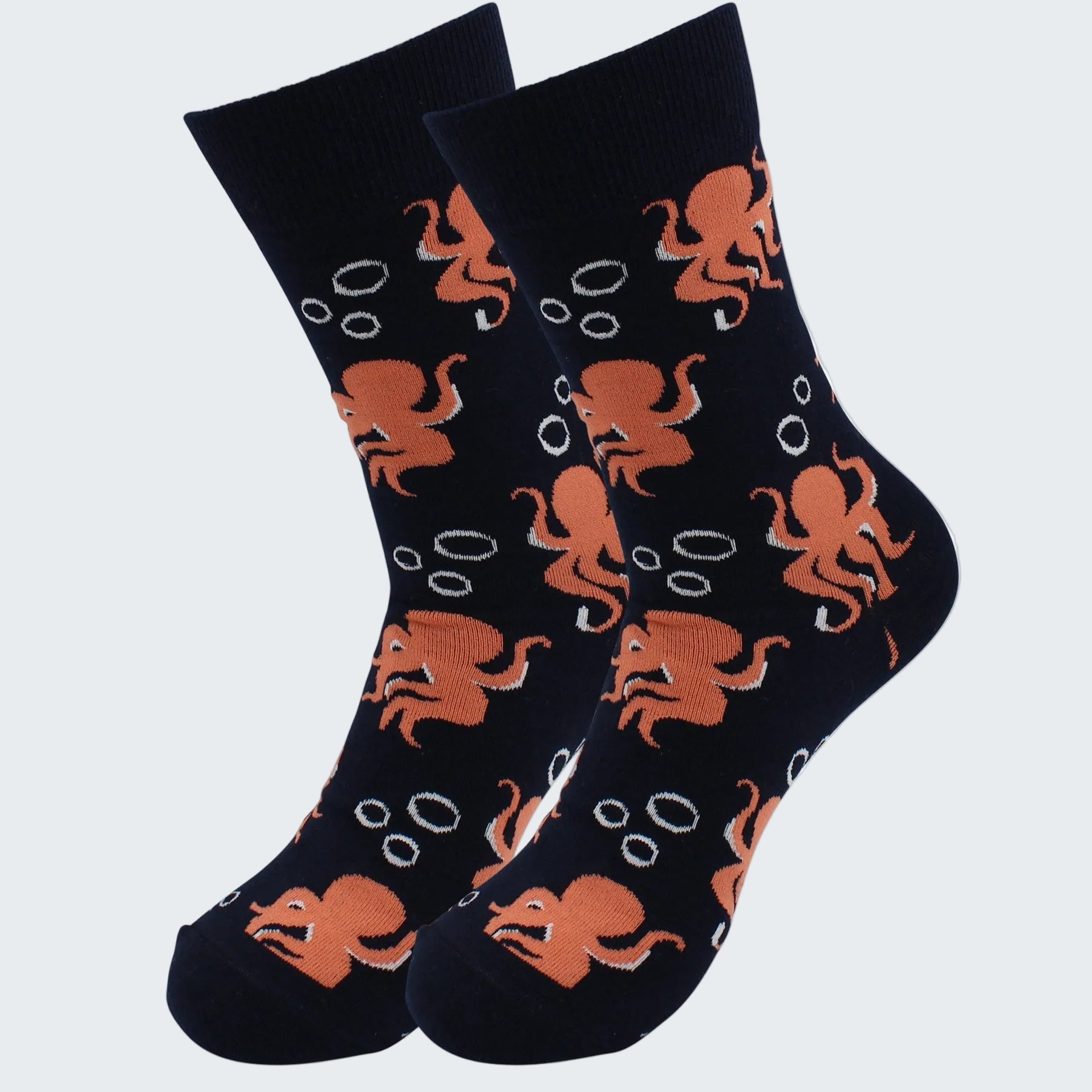 Black socks with orange octopus pattern on a white background