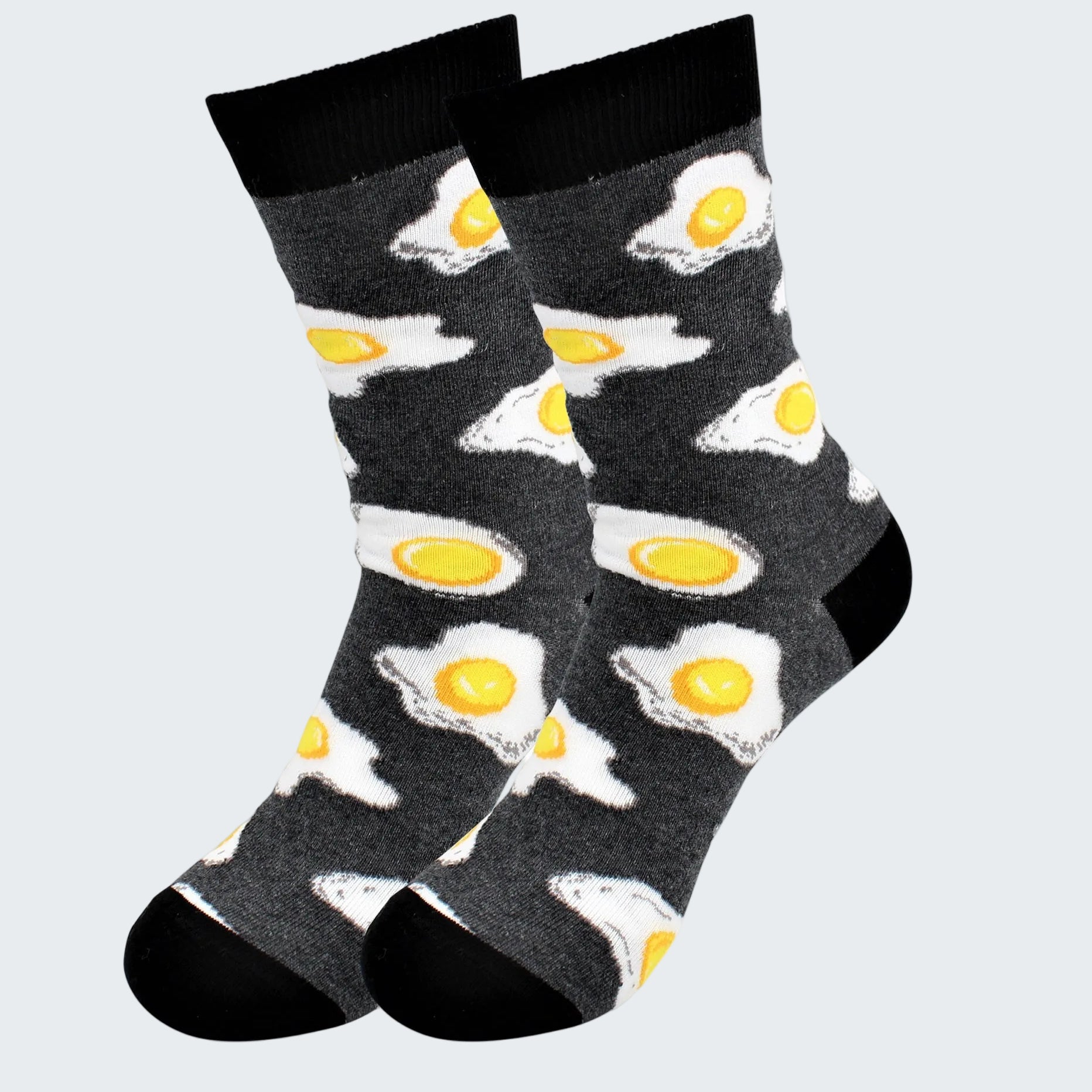 Pair of socks with fried egg design on a white background