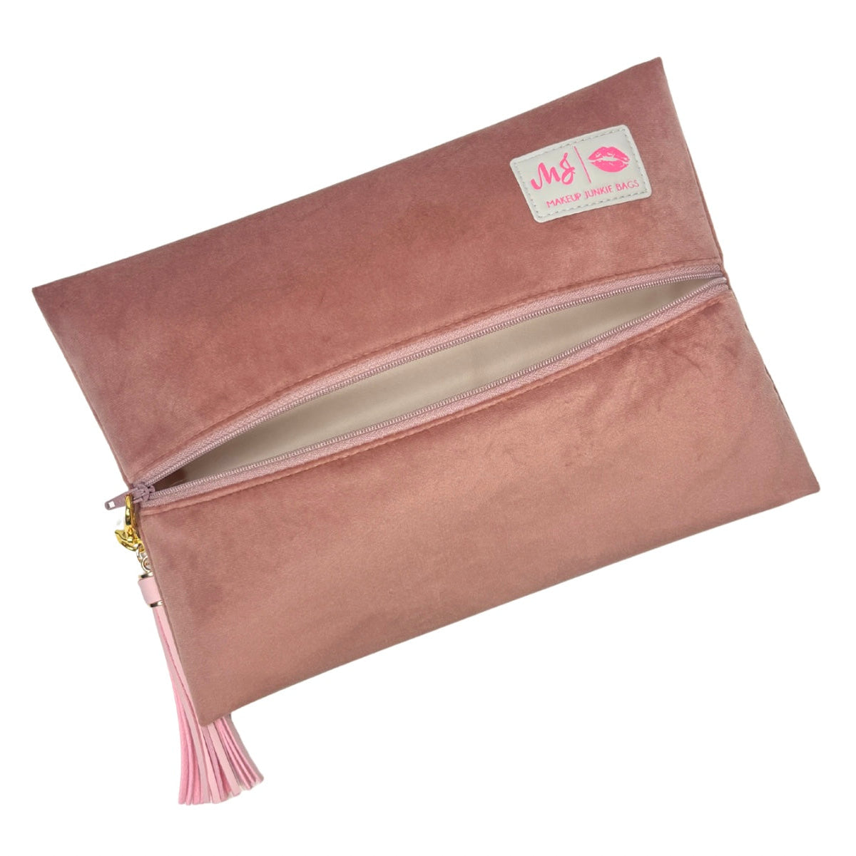 Pink suede clutch bag with a tassel on a white background