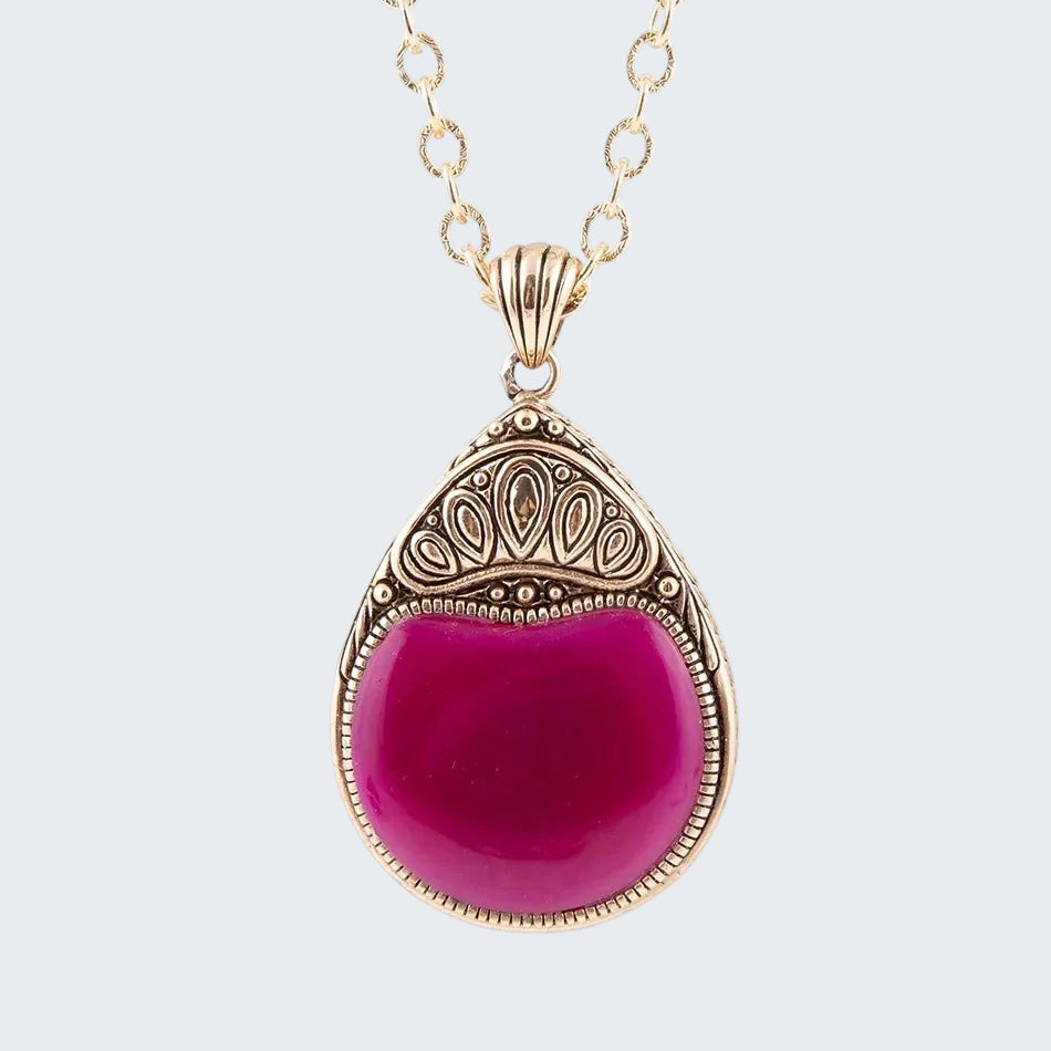 Necklace with a pink pendant on a white background