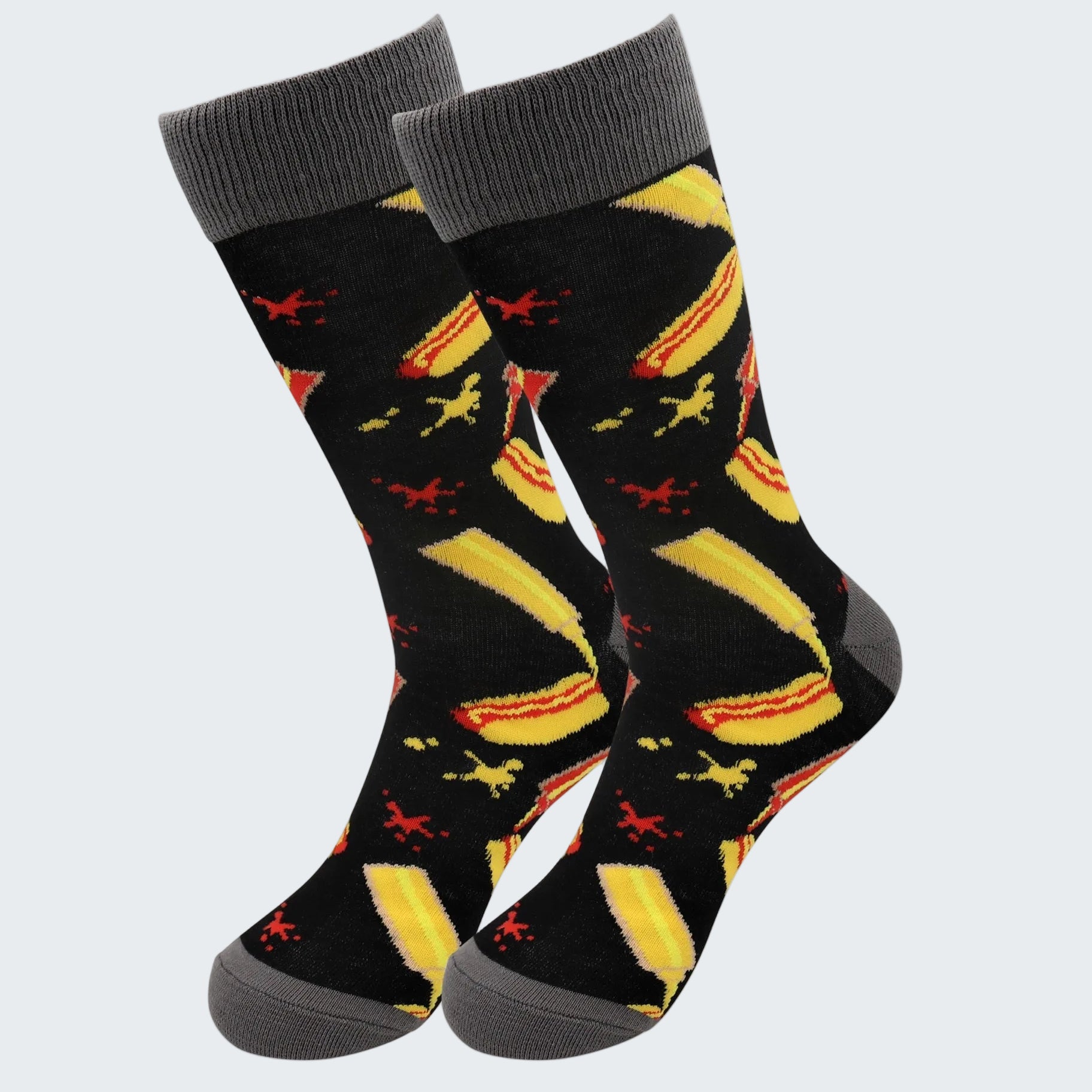 Pair of socks with banana and airplane pattern on a white background