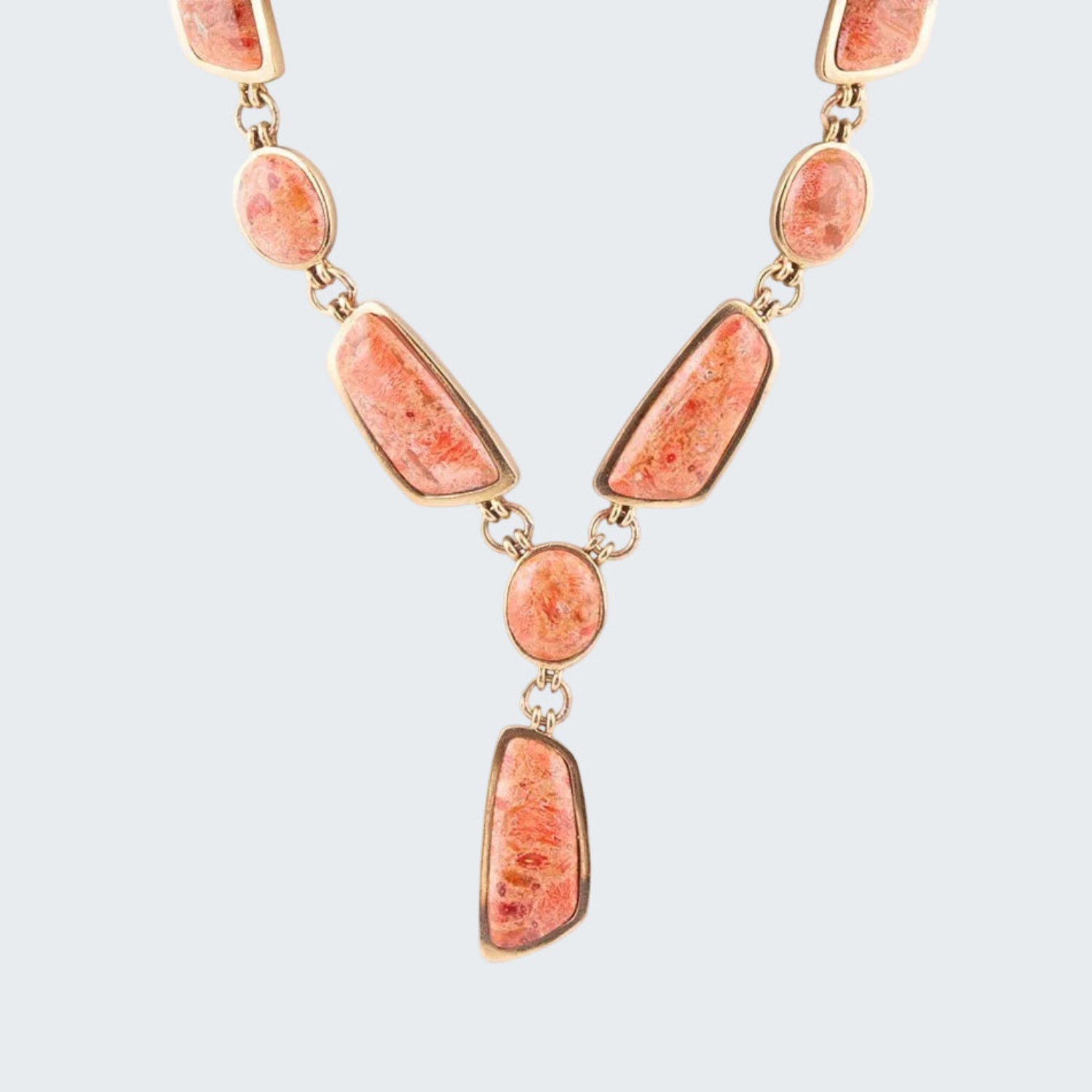 Necklace with pink stone beads on a white background