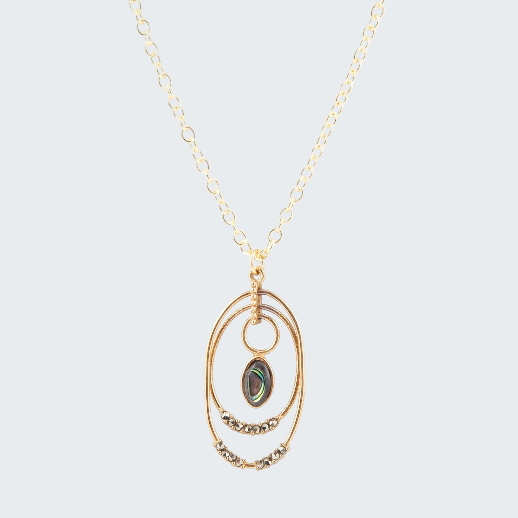 Gold necklace with a pendant on a white background