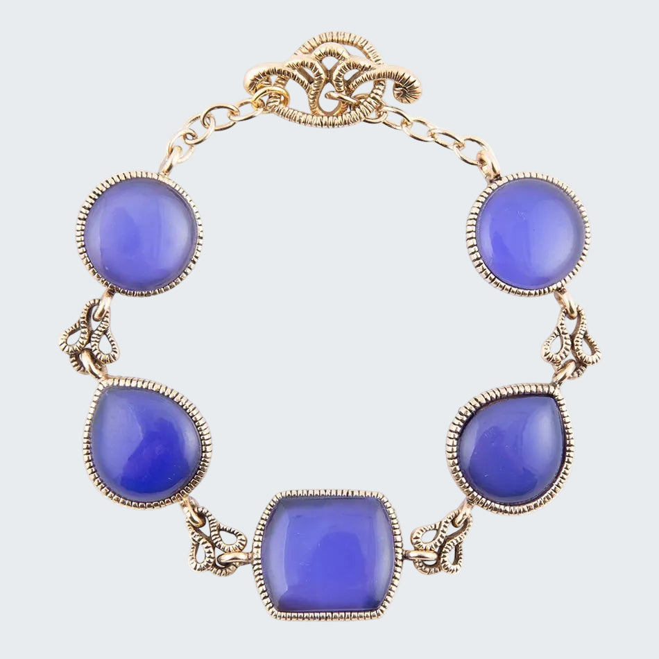 Necklace with blue stones and gold chain on a white background