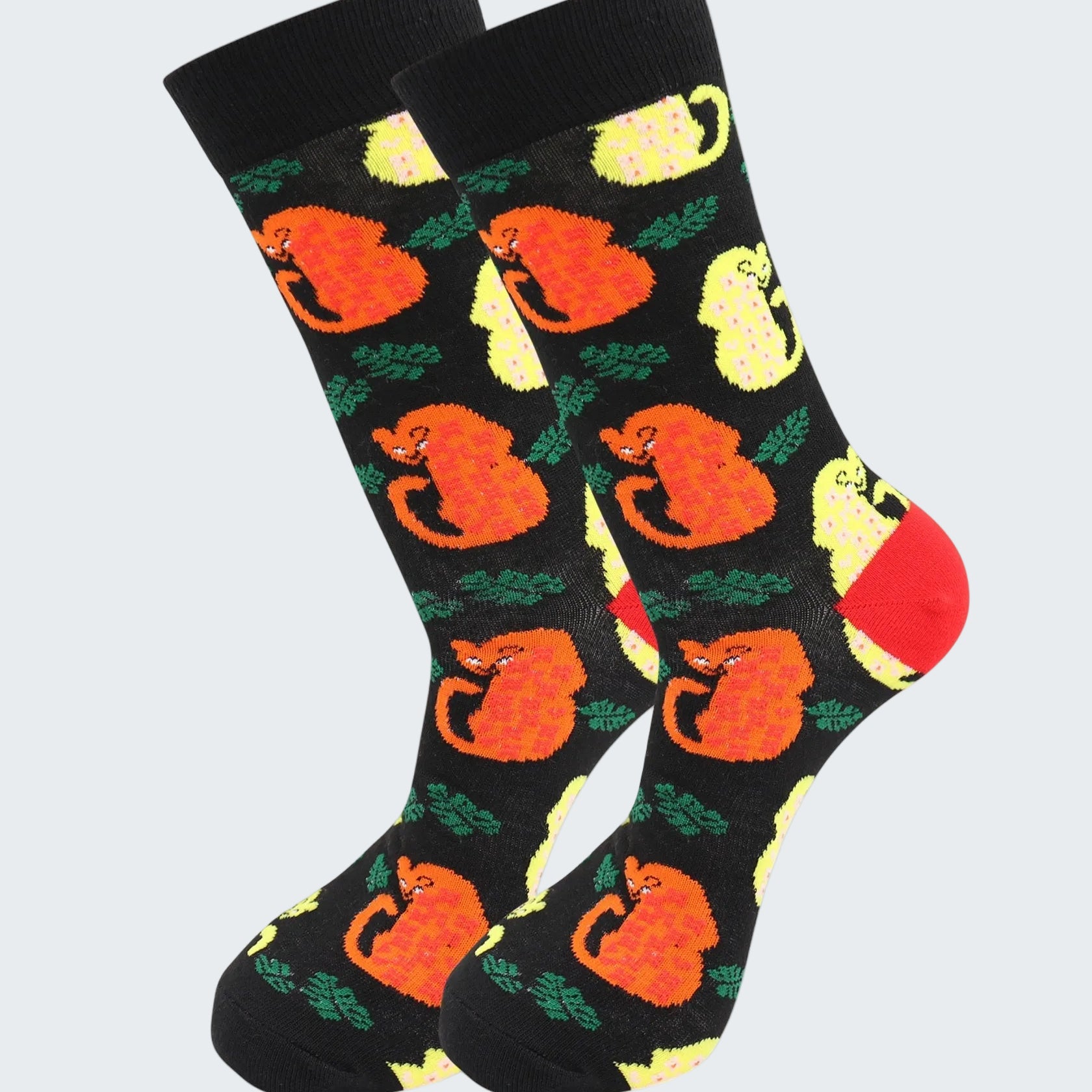 Black socks with orange fox and yellow flower pattern on a white background
