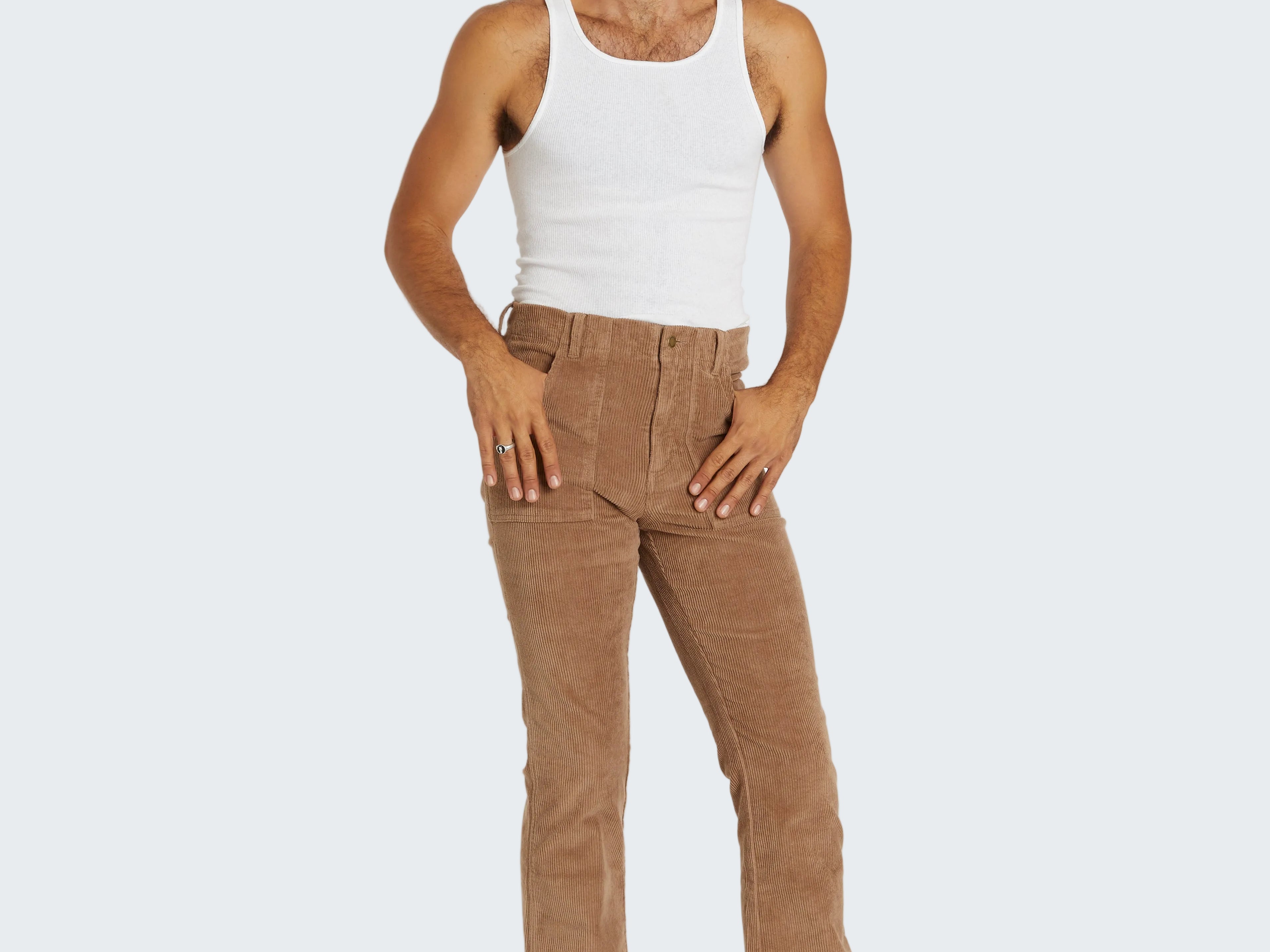 Man wearing a white tank top and brown pants on a white background