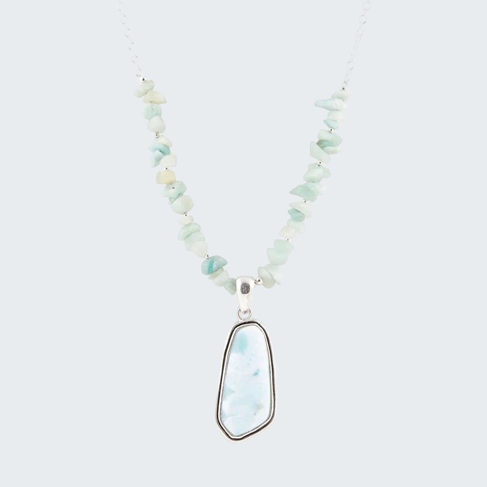 Necklace with light blue pendant on a white background