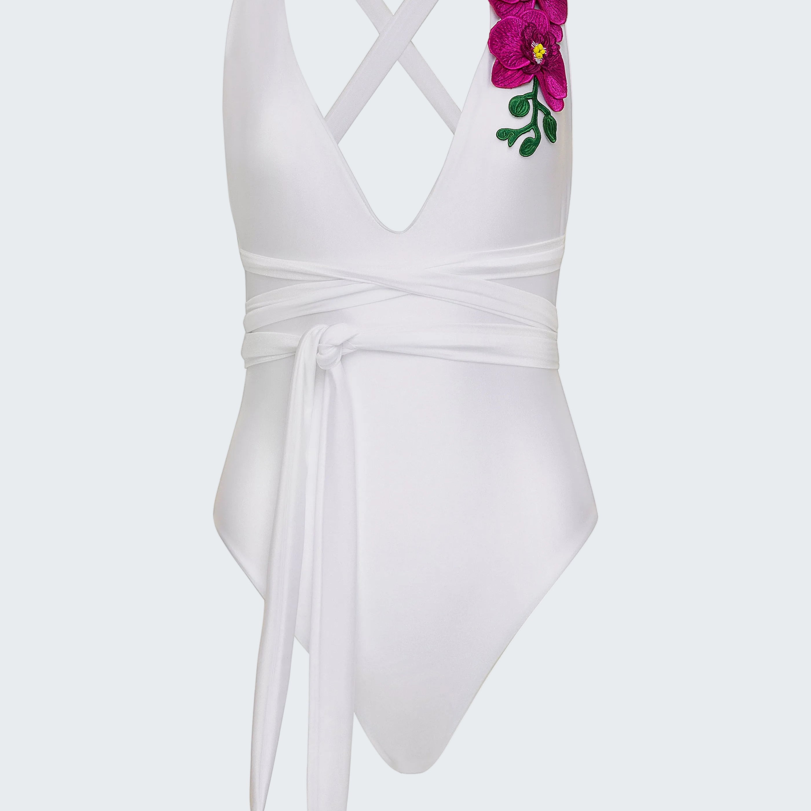 White swimsuit with floral design on a white background