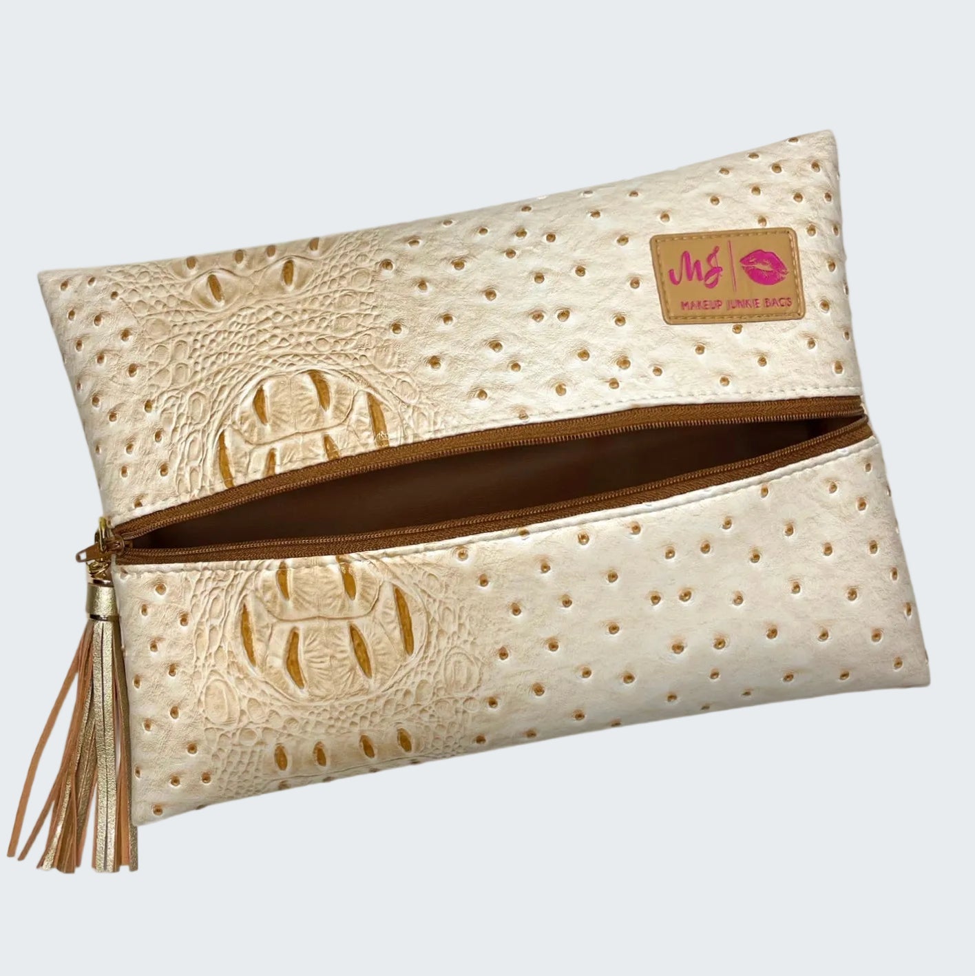Beige clutch bag with embossed design and visible brand logo on a white background