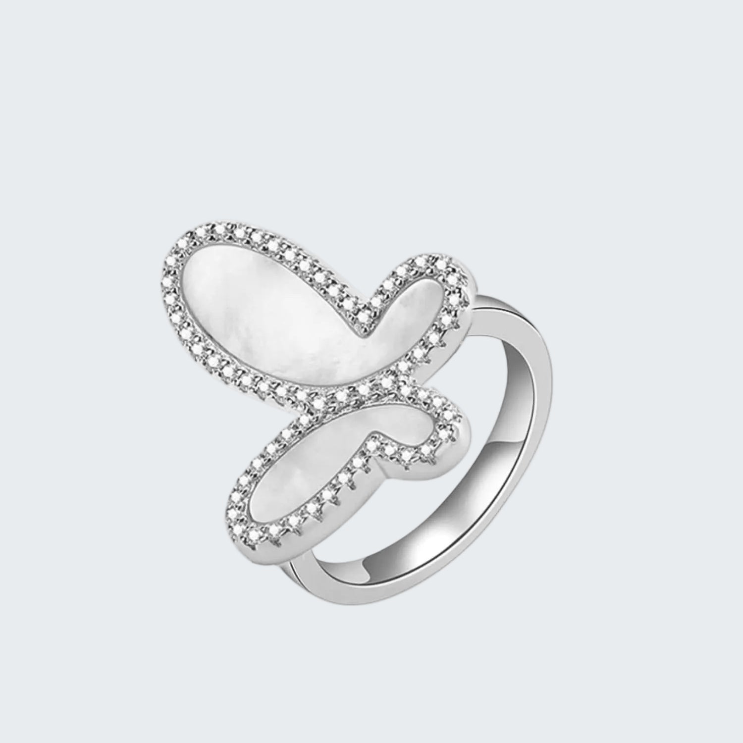 Silver ring with a heart-shaped design on a white background