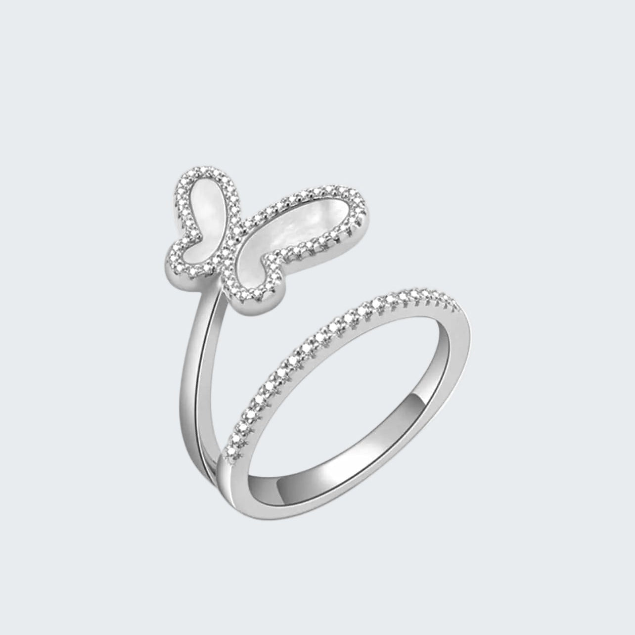 Silver ring with butterfly design on a white background