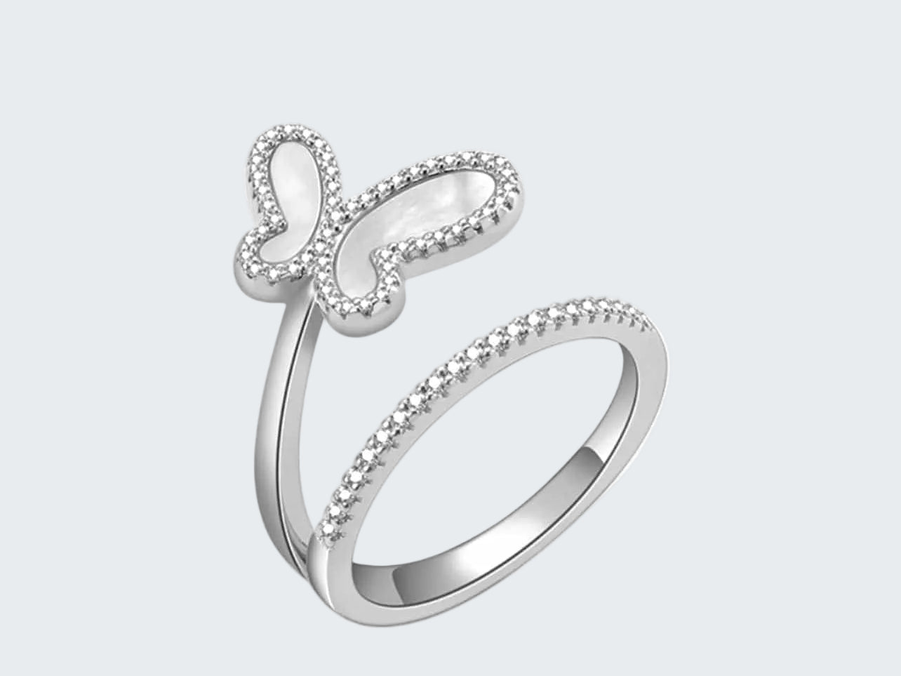 Silver ring with butterfly design on a white background