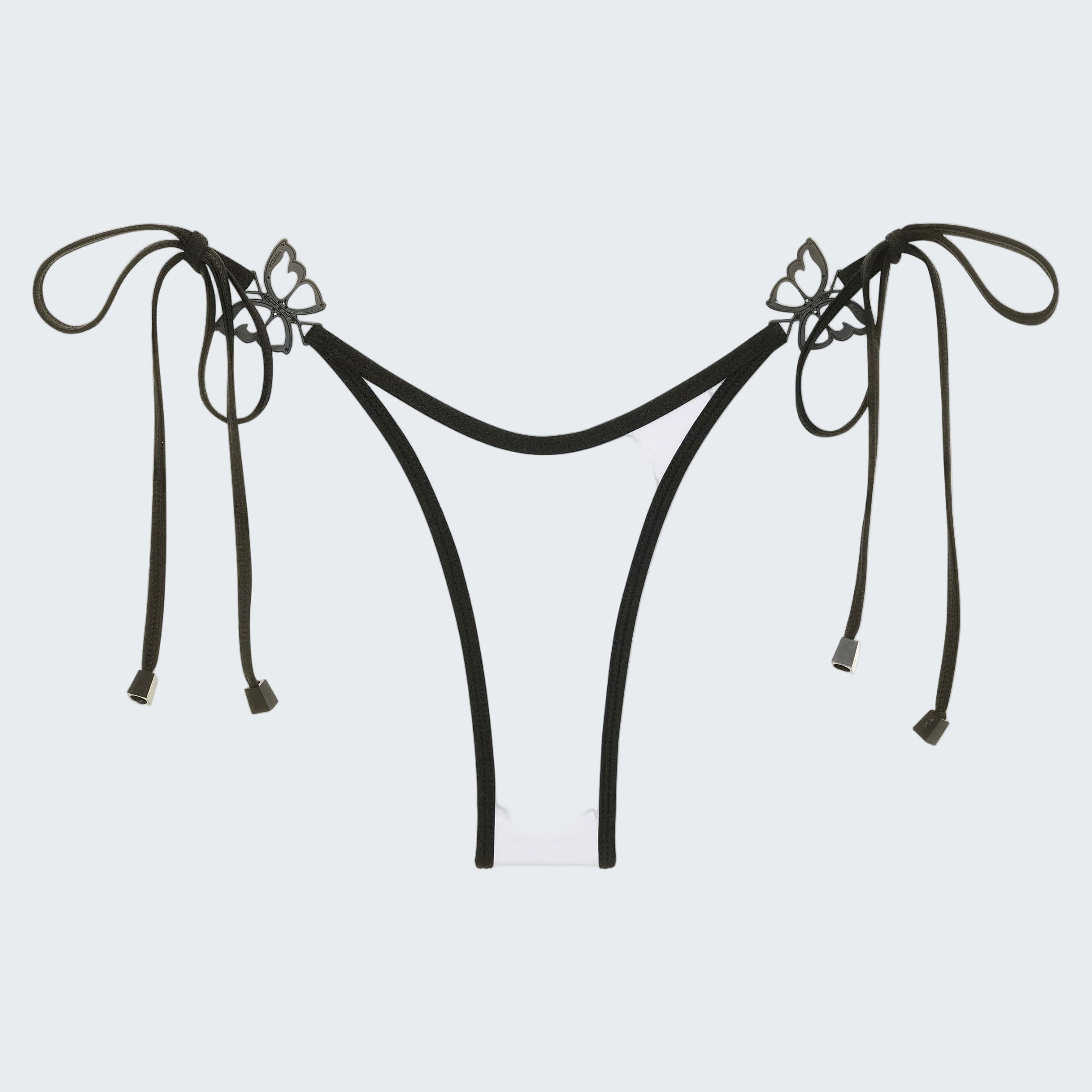 White bikini bottom with black straps and bows on a white background