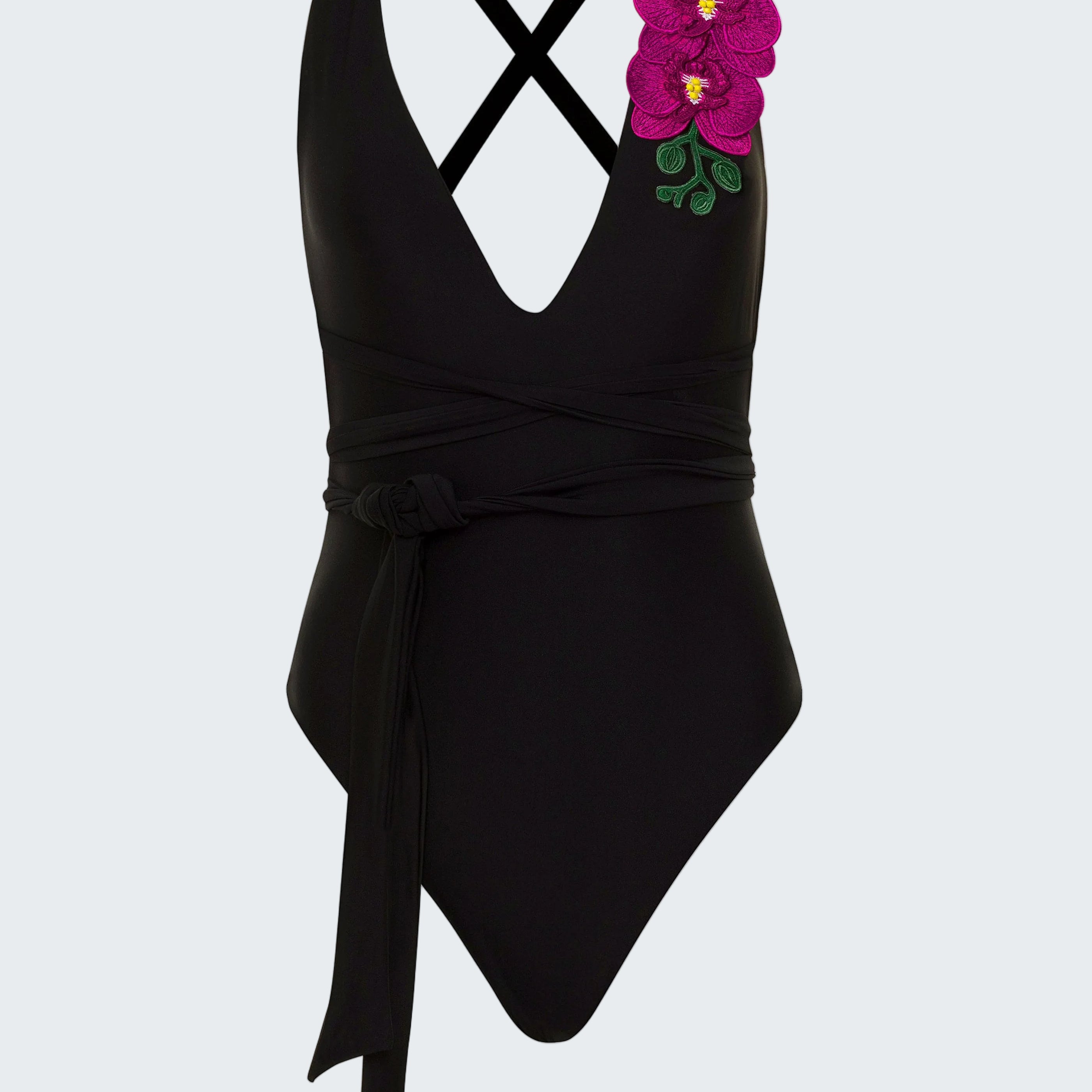 Black swimsuit with floral design on a white background