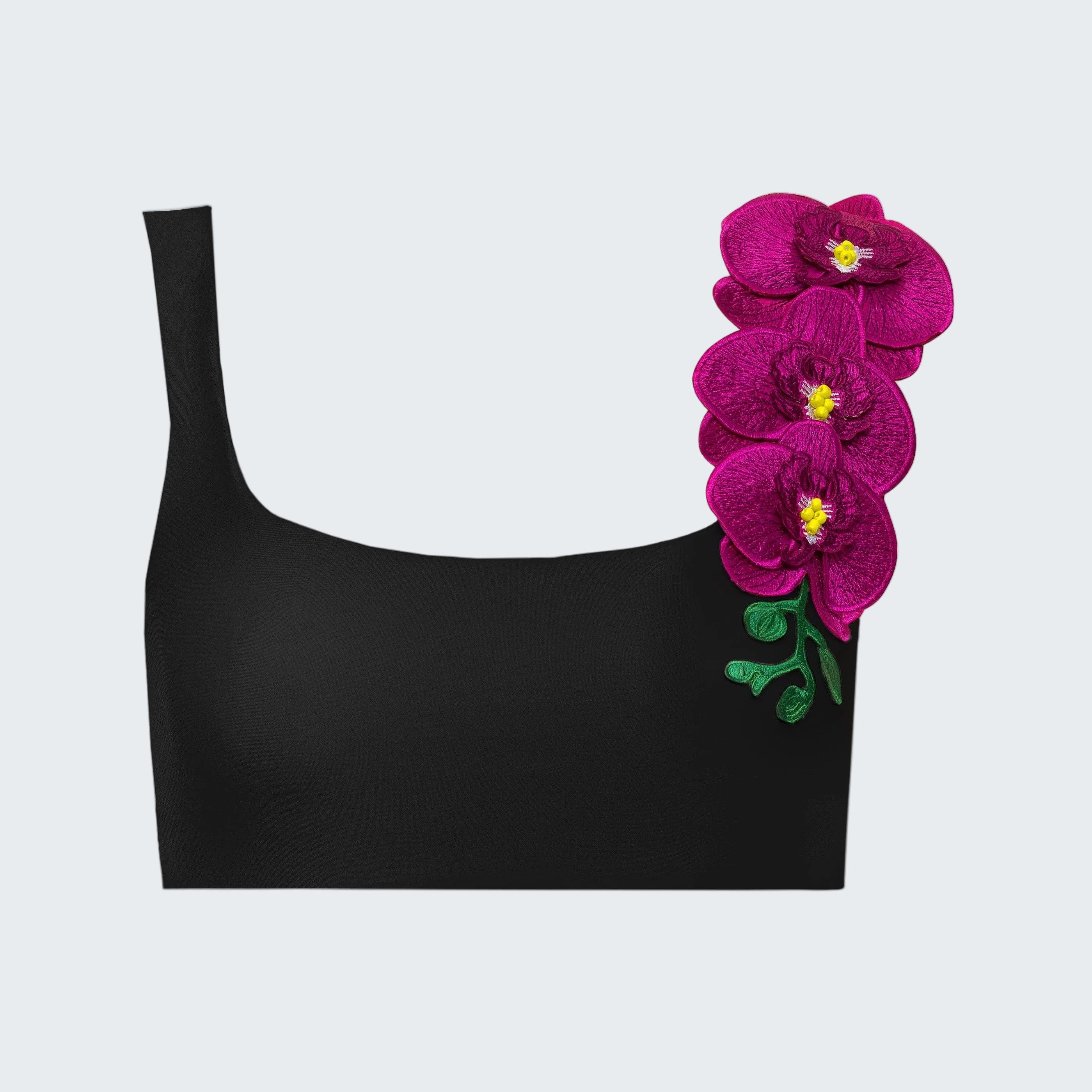 Black top with pink floral embellishments on a white background