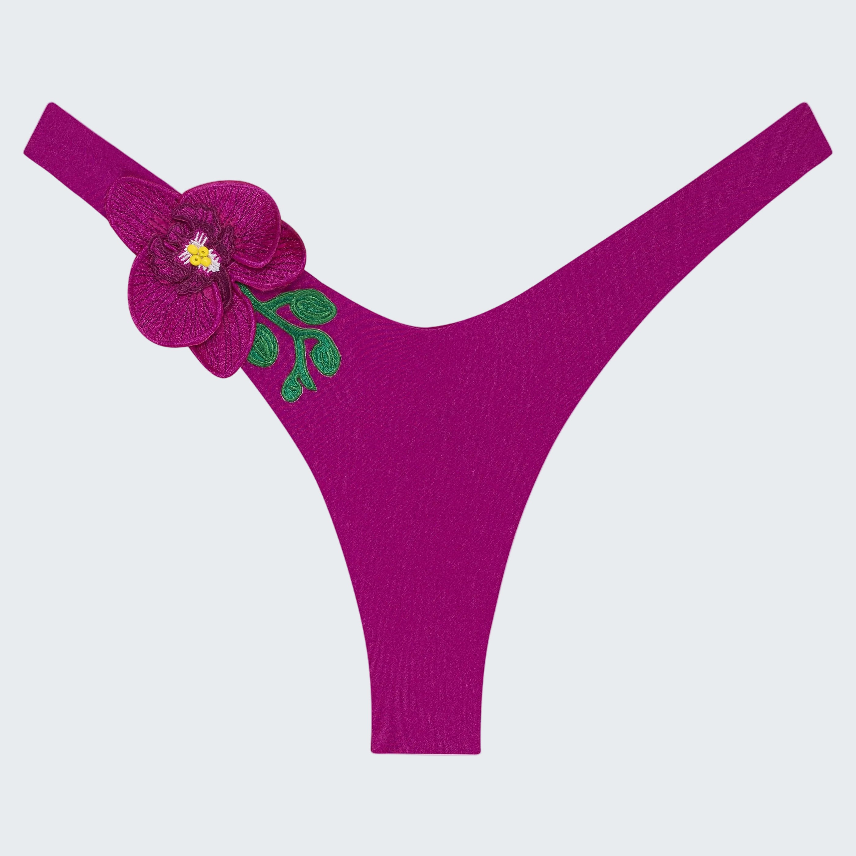 Purple thong with floral design on a white background