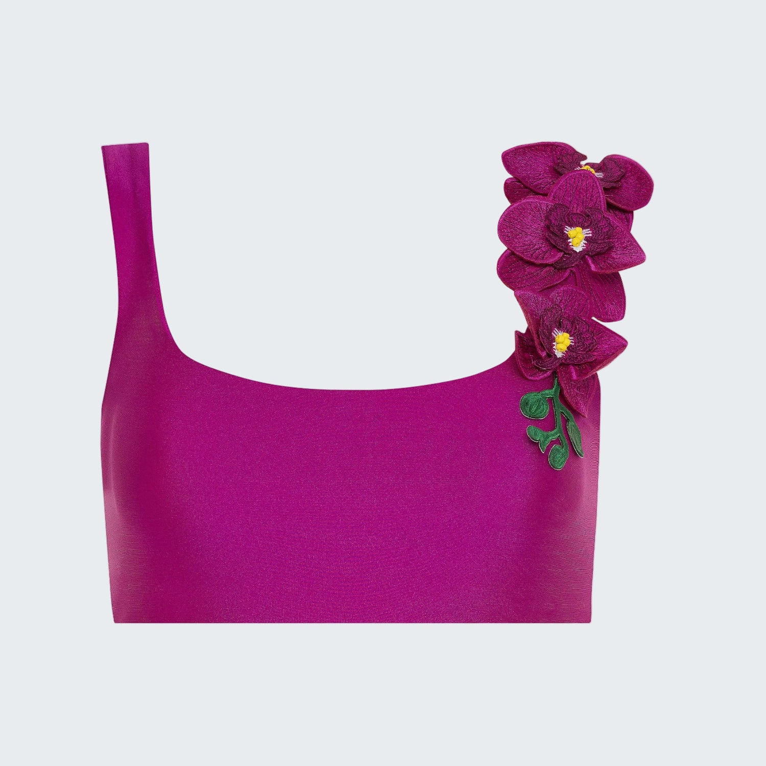 Purple top with a floral decoration on a white background