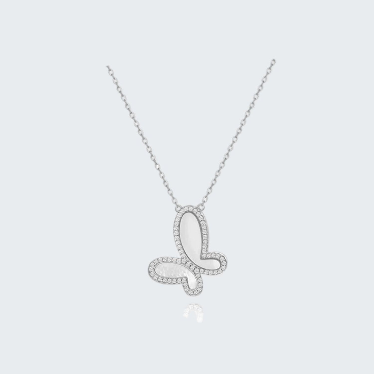 Butterfly-shaped silver necklace on a white background