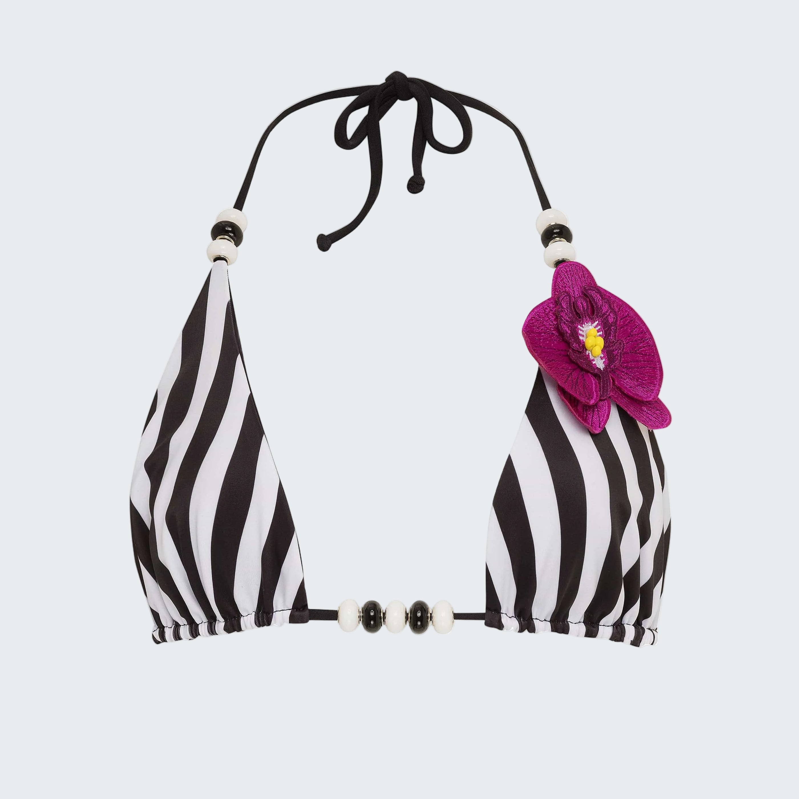 Black and white striped bikini top with a pink flower on a white background