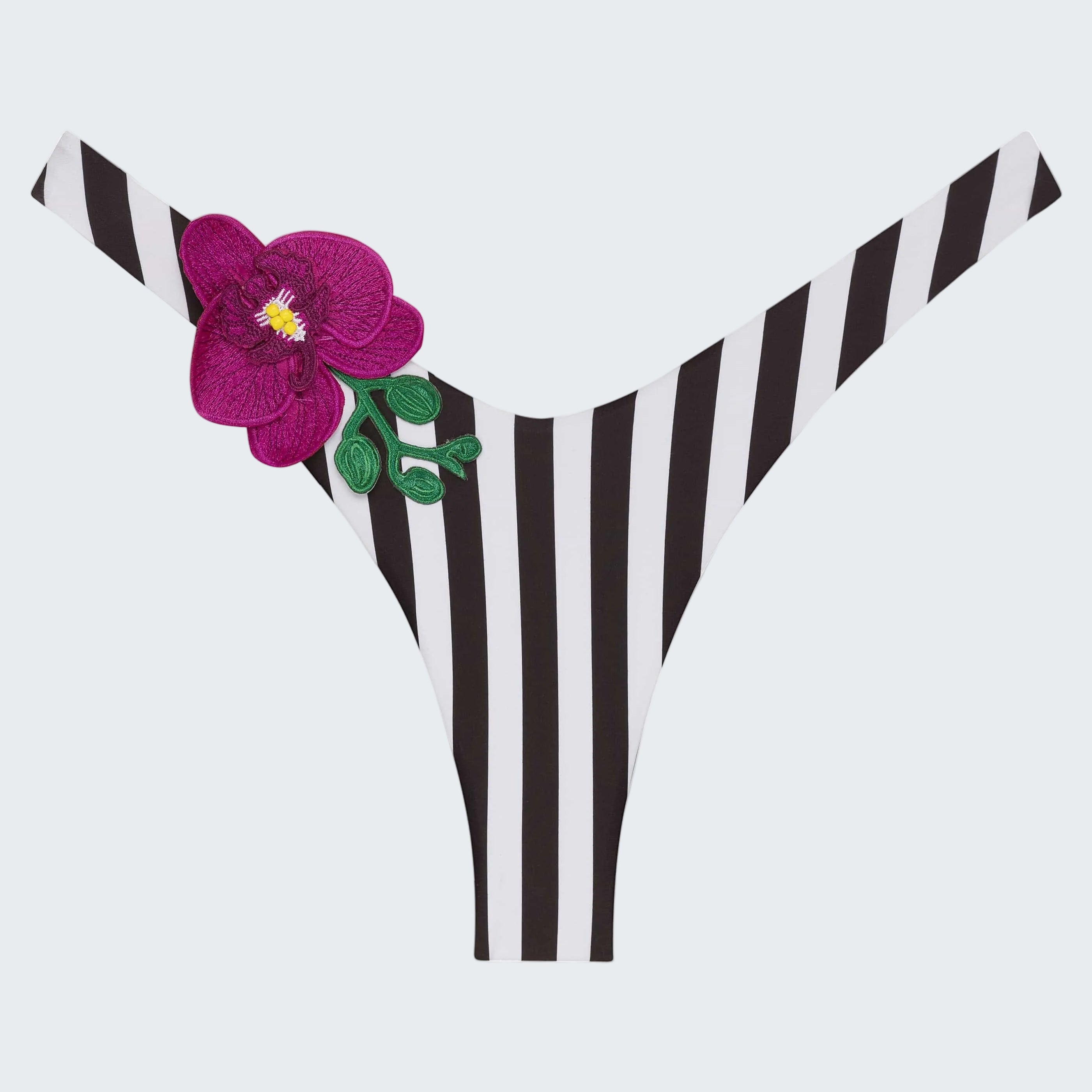 Black and white striped bikini bottom with a purple flower on a white background