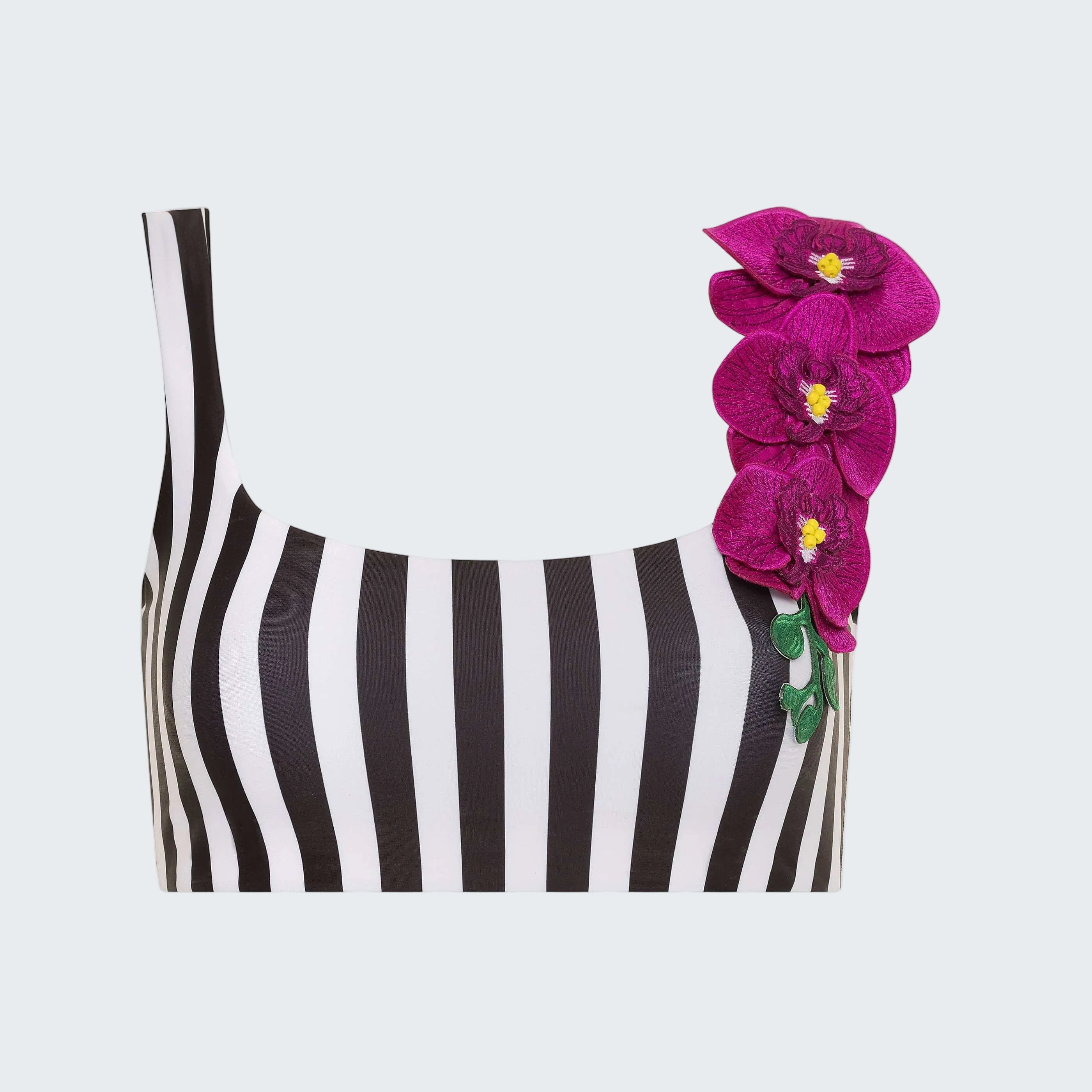 Black and white striped top with pink floral accessory on a white background