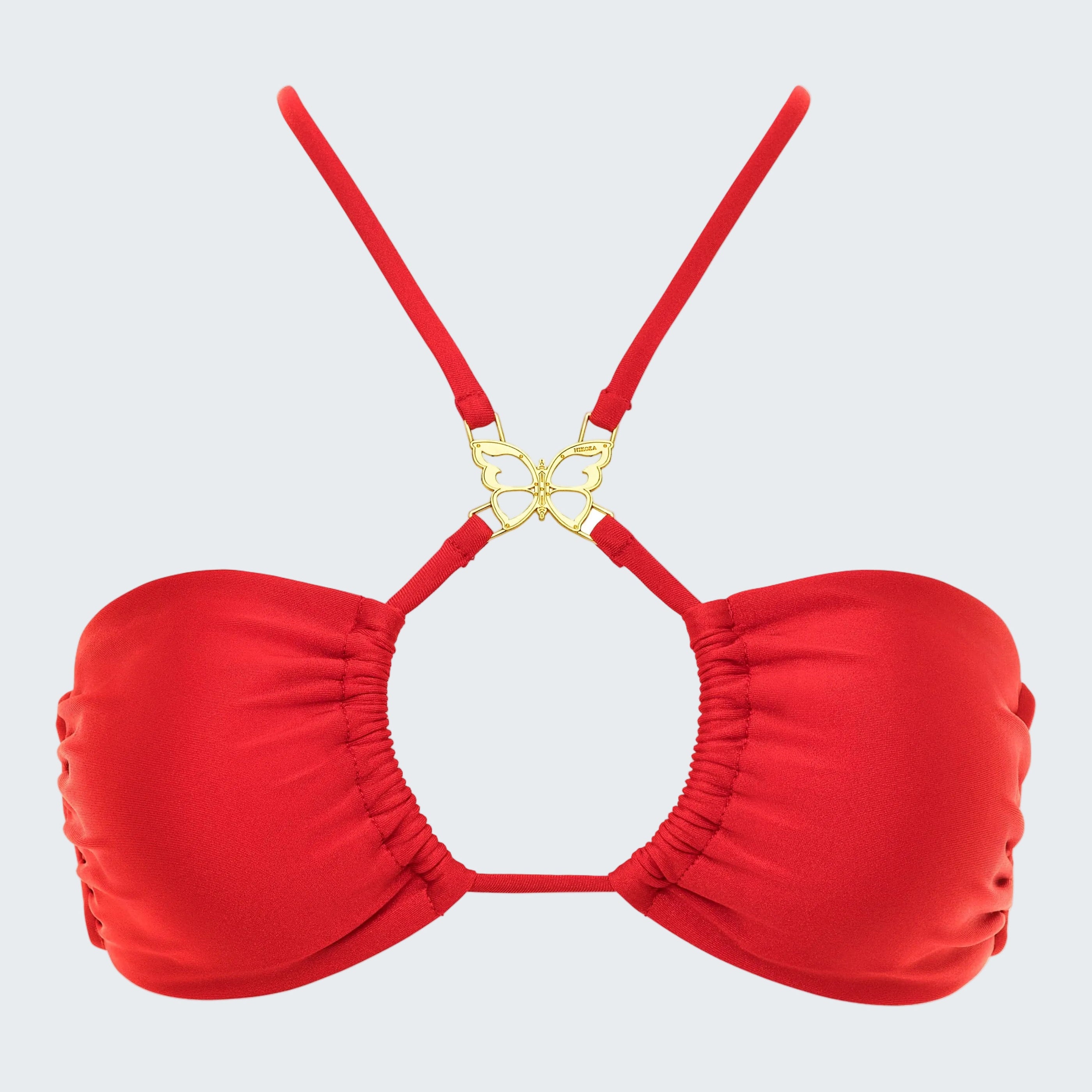 Red bikini top with gold clasp on a white background