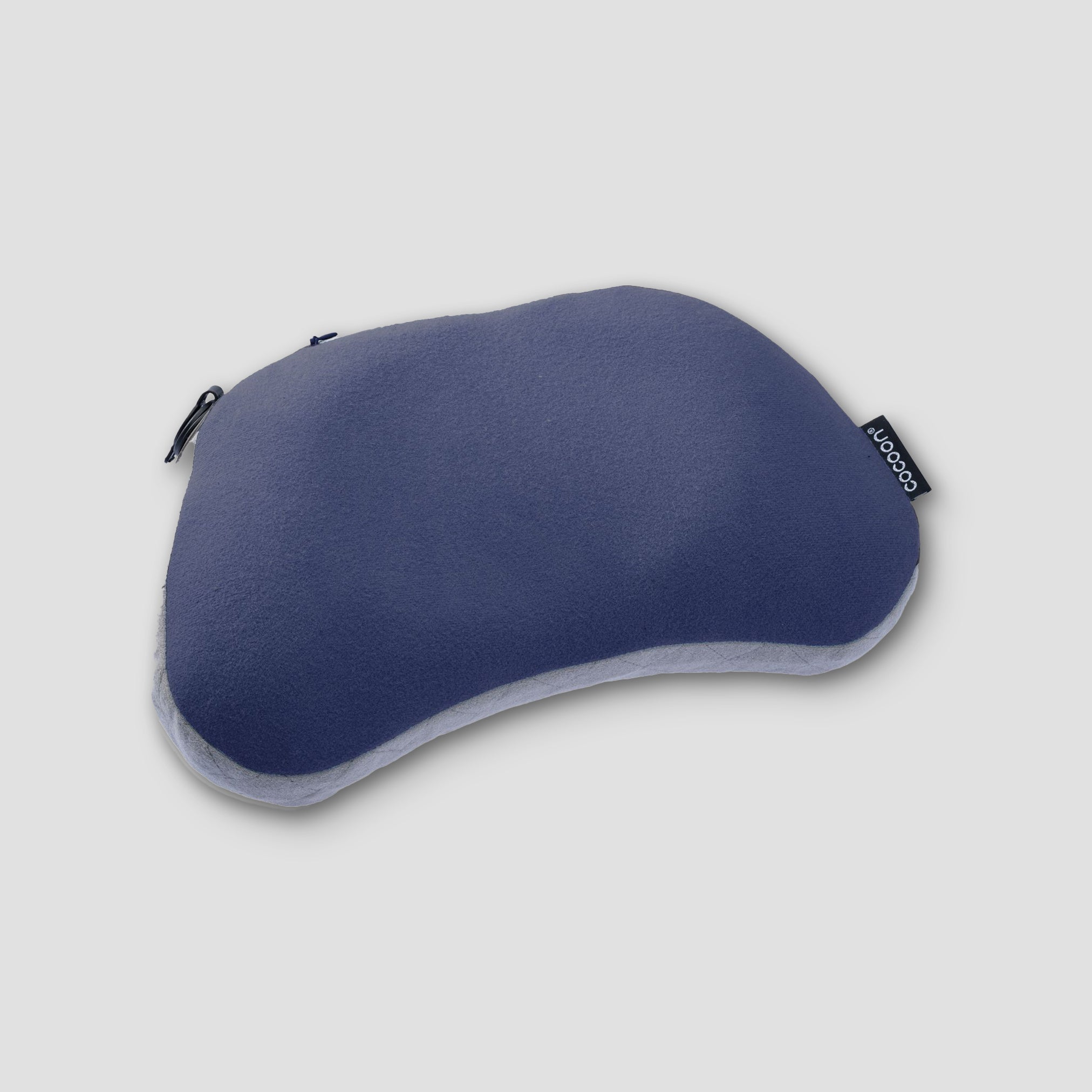 Blue travel pillow on a light gray background
