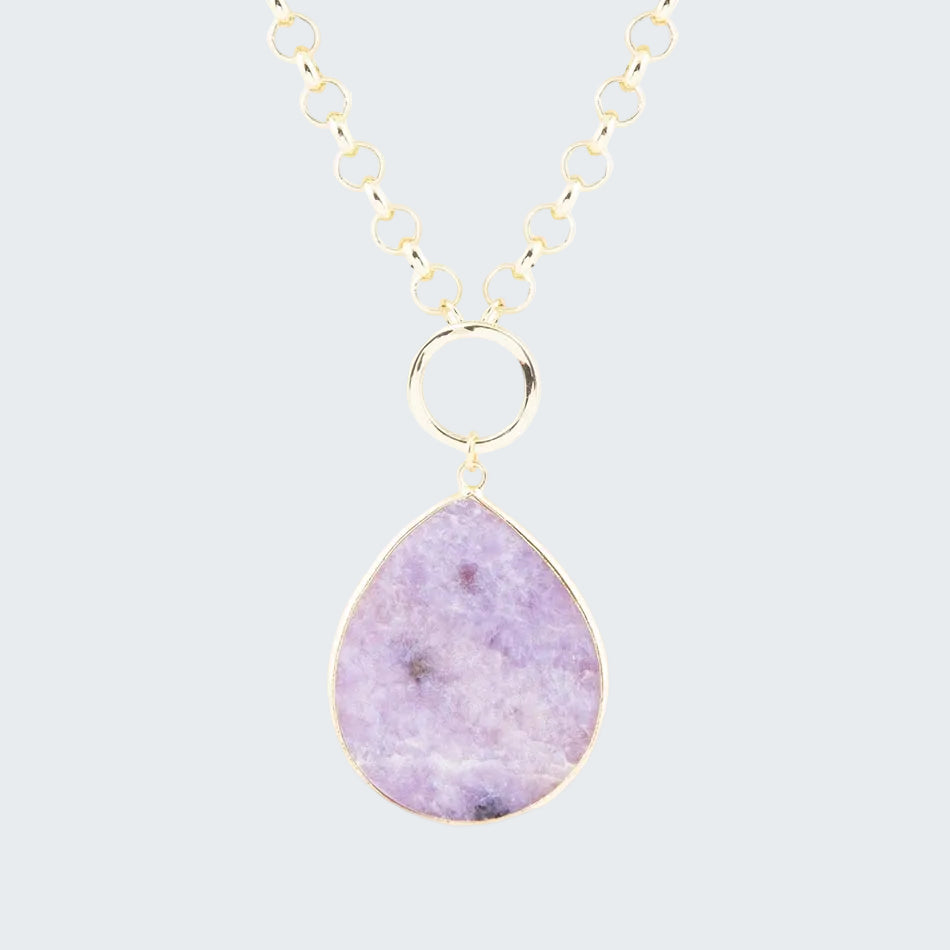 Necklace with a teardrop-shaped purple pendant on a gold chain against a white background