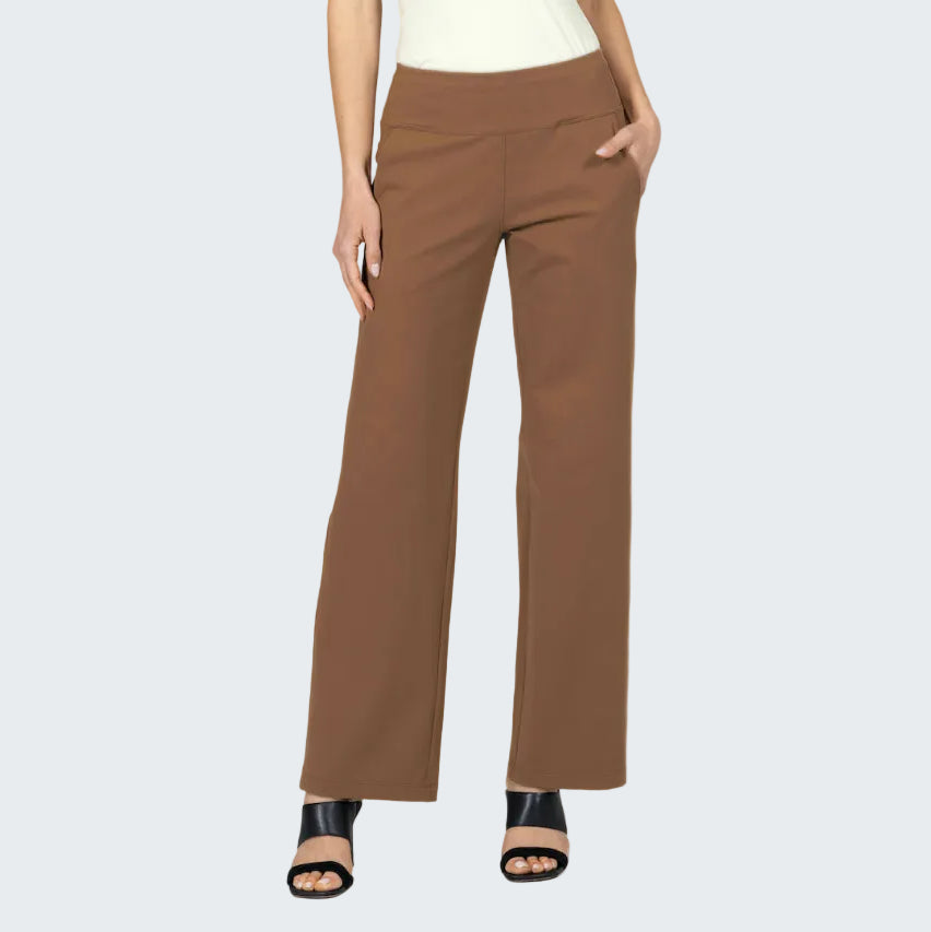 Brown pants worn by a person on a gray background