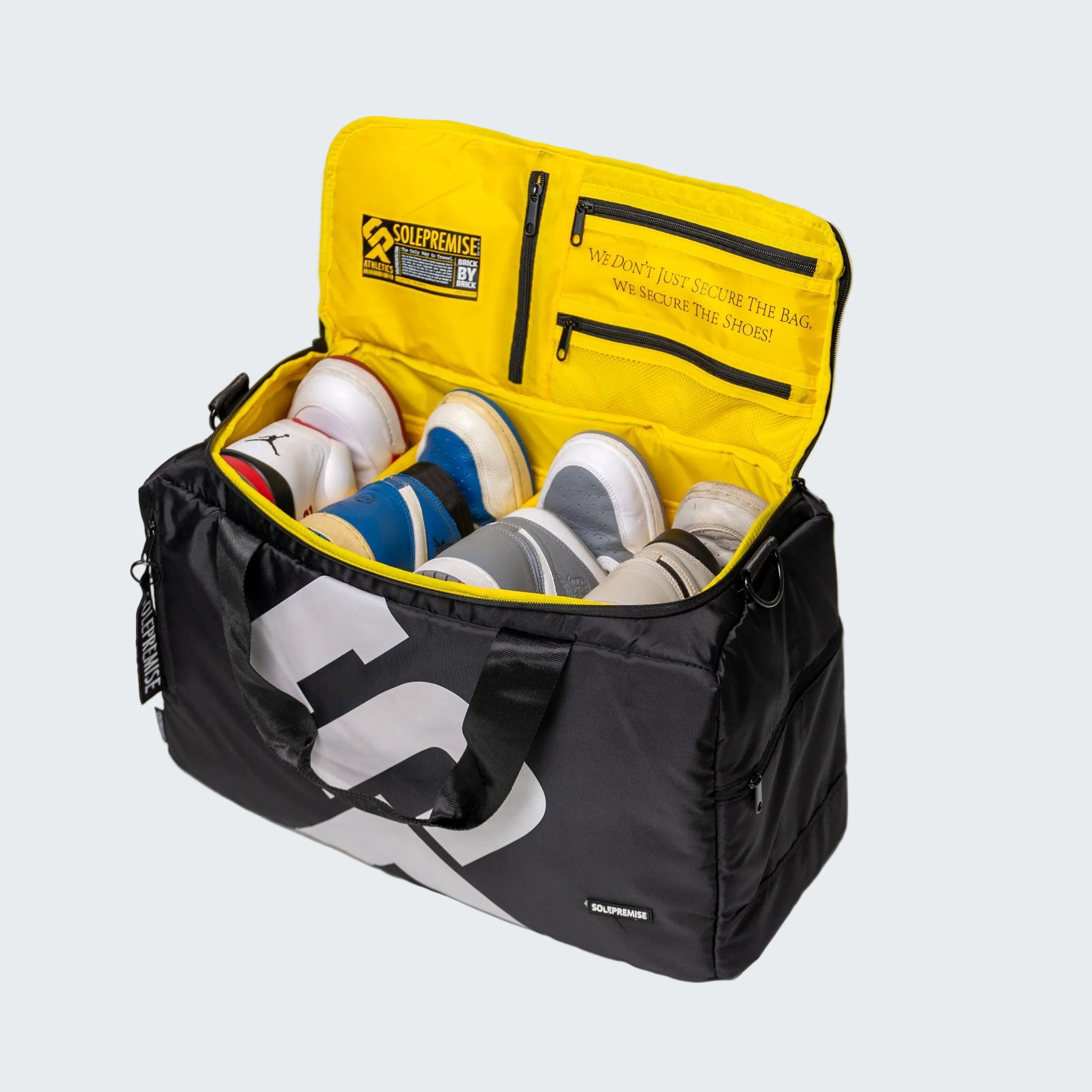 Black and yellow bag with shoes inside on a white background
