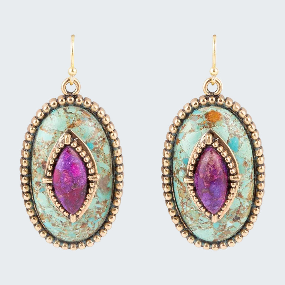 Pair of earrings with purple gemstone and gold accents on a white background