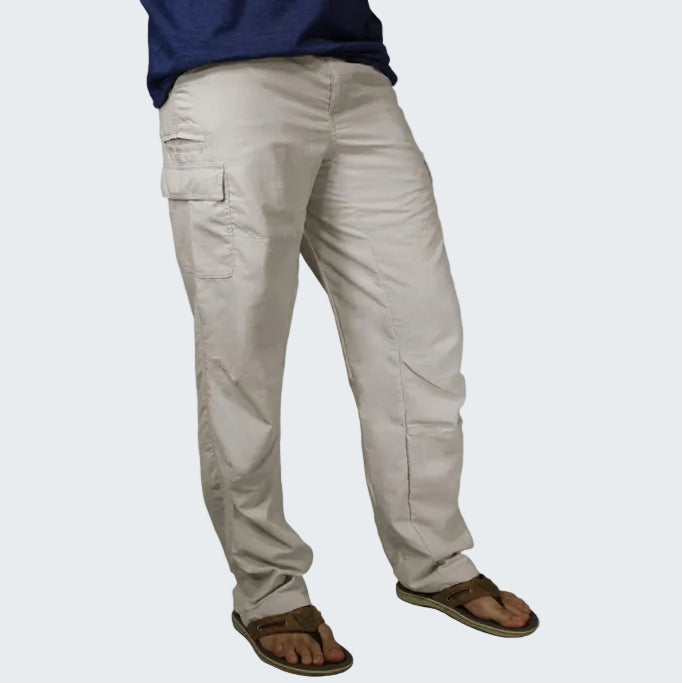 Beige cargo pants worn by a person on a white background