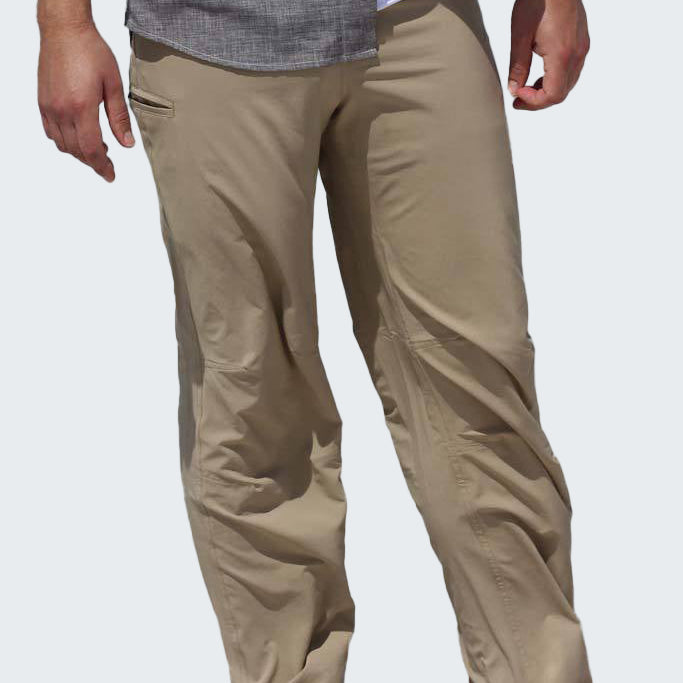 Beige pants worn by a person on a white background