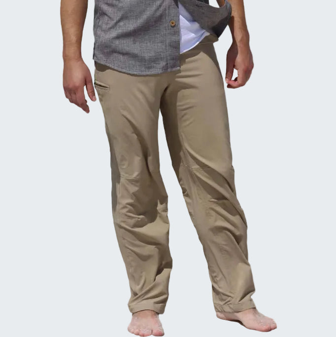 Beige pants worn by a person on a white background