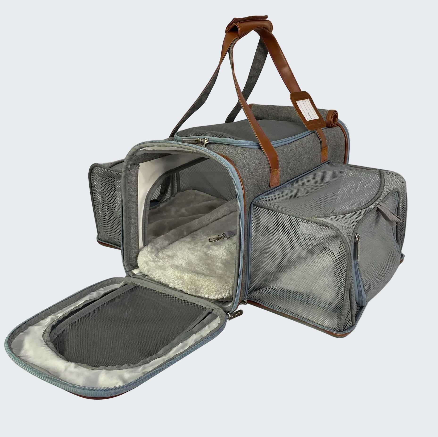 Gray pet carrier with open door on a white background