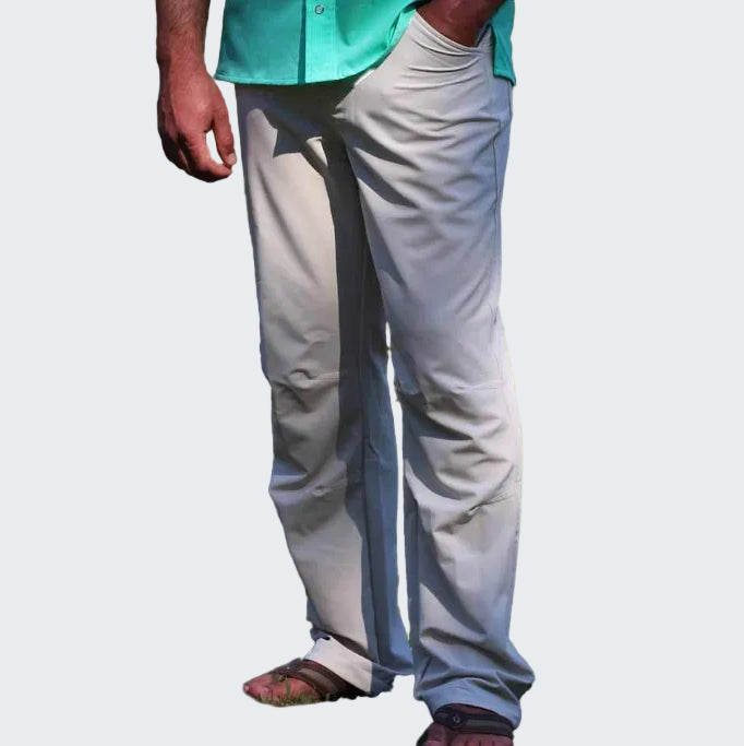 Person wearing light gray pants with a dark stripe on a white background