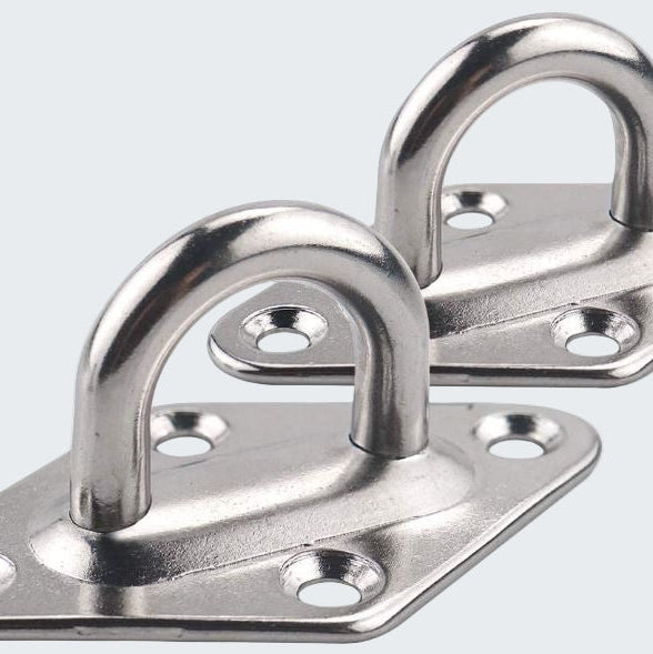 Two metal hooks on plates with holes on a white background