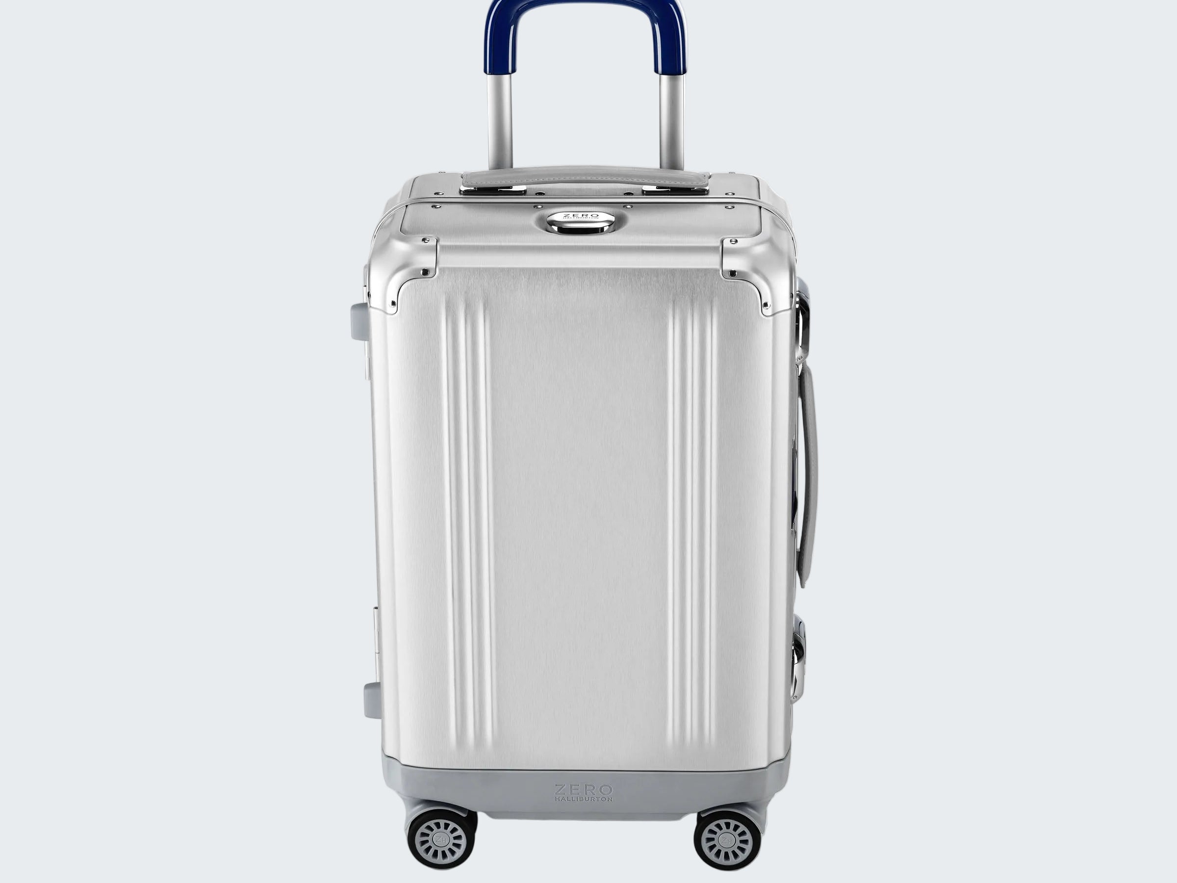 Silver suitcase with a blue handle on a white background