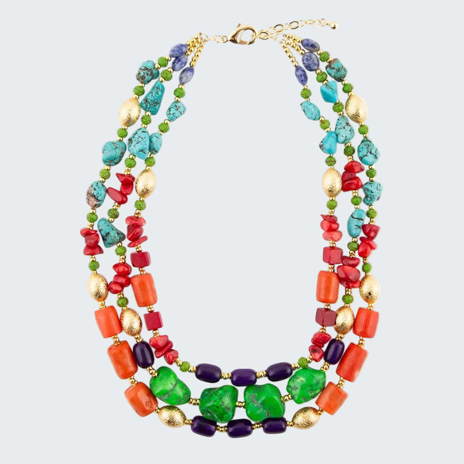 Colorful beaded necklace with gold clasp on a white background