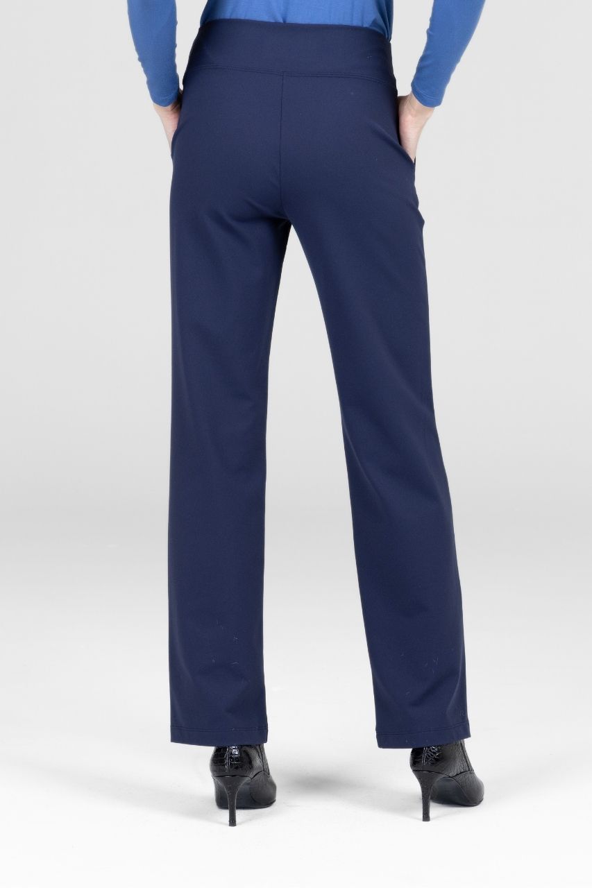Navy blue dress pants worn by a person on a white background